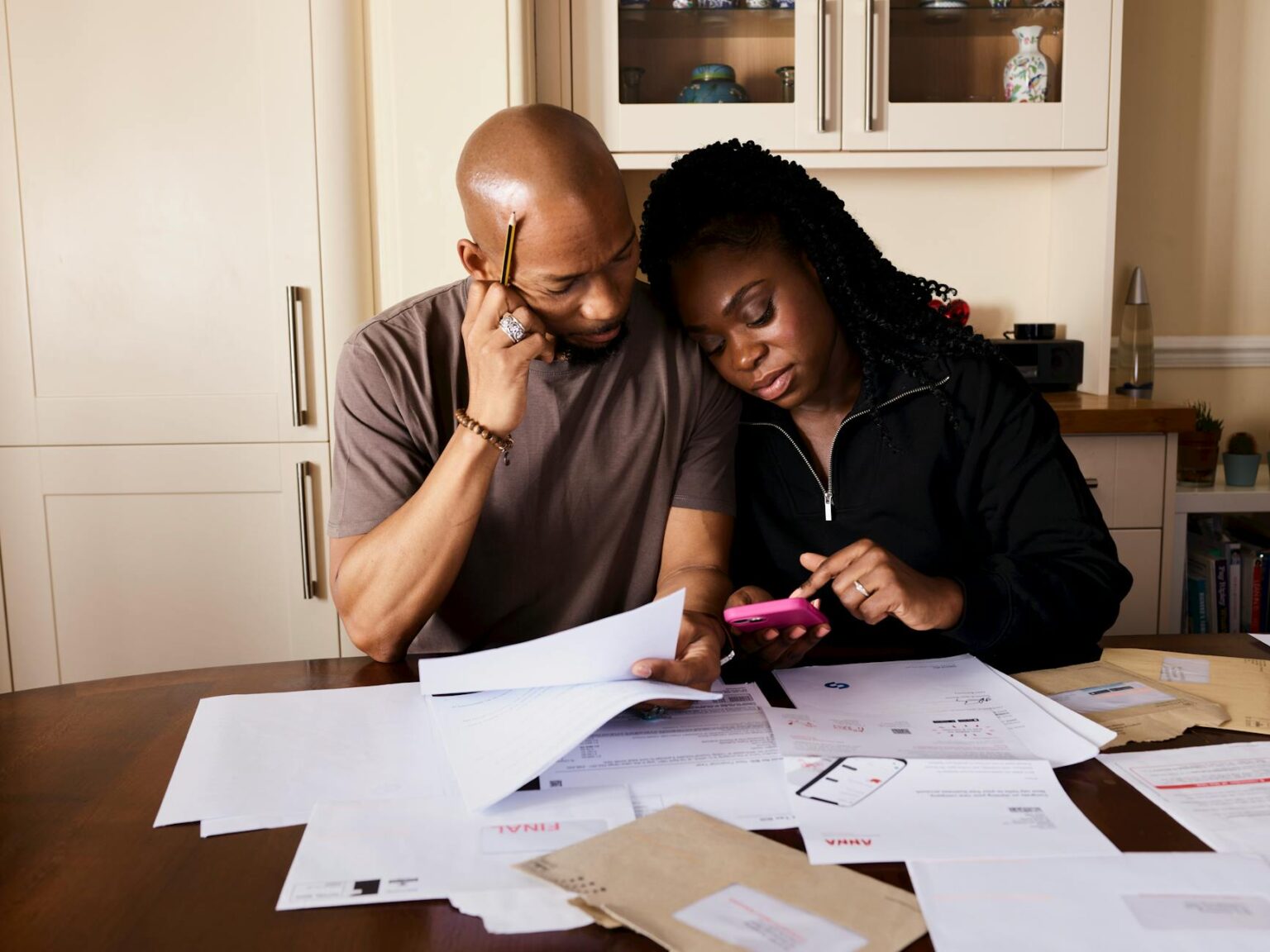 Family reviewing financial documents and planning charitable giving strategy at home
