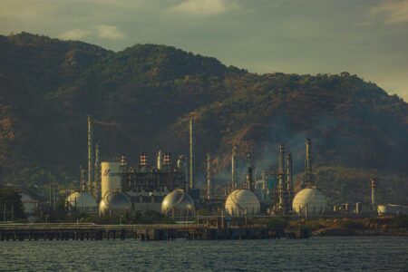 Modern water treatment facility with large industrial pipes and processing equipment