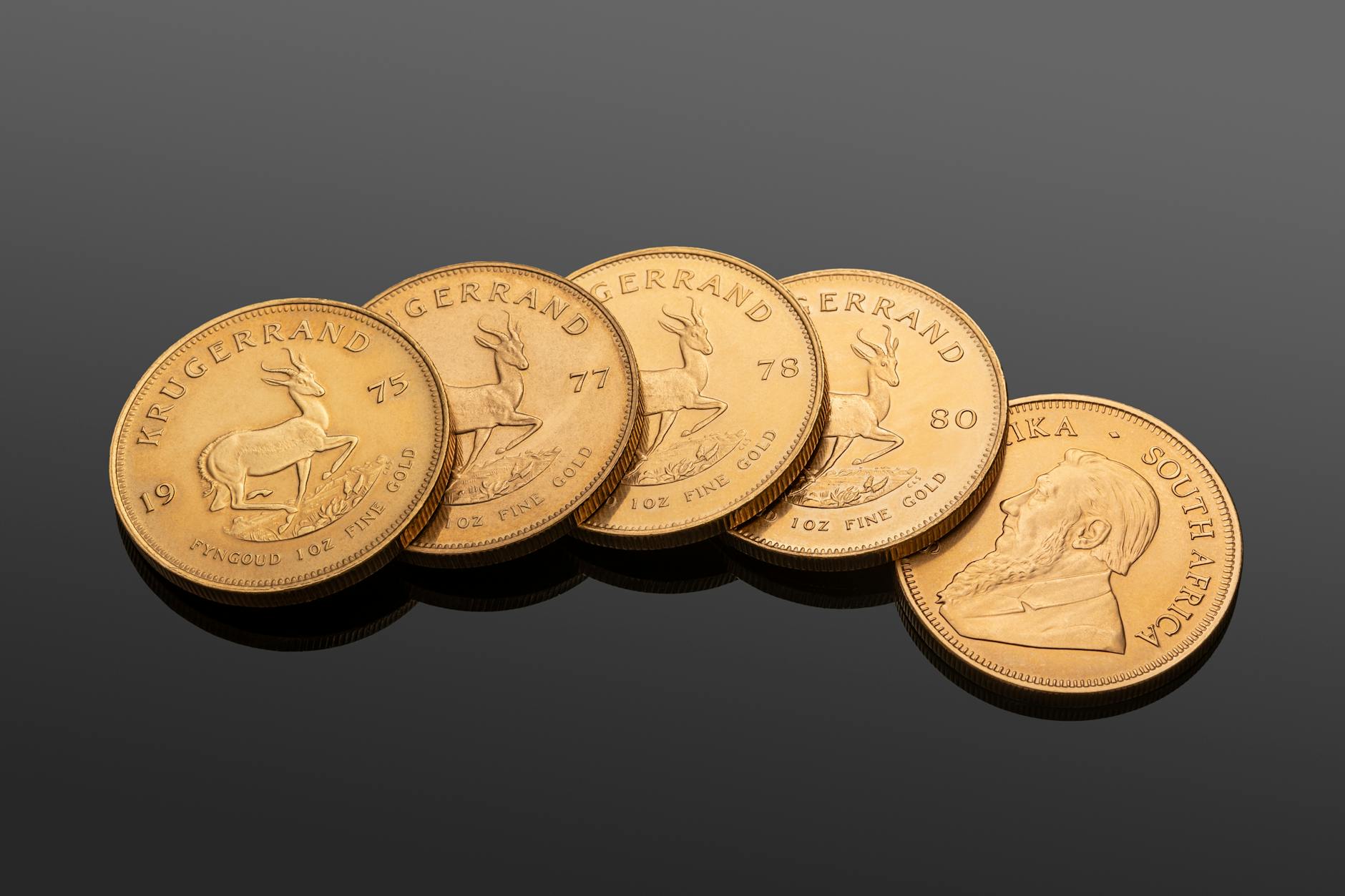 Stack of gold coins representing precious metals investment options for retirement accounts