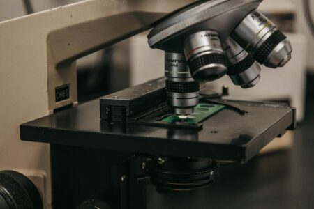 Scientific laboratory equipment with microscope for biotech research and drug development