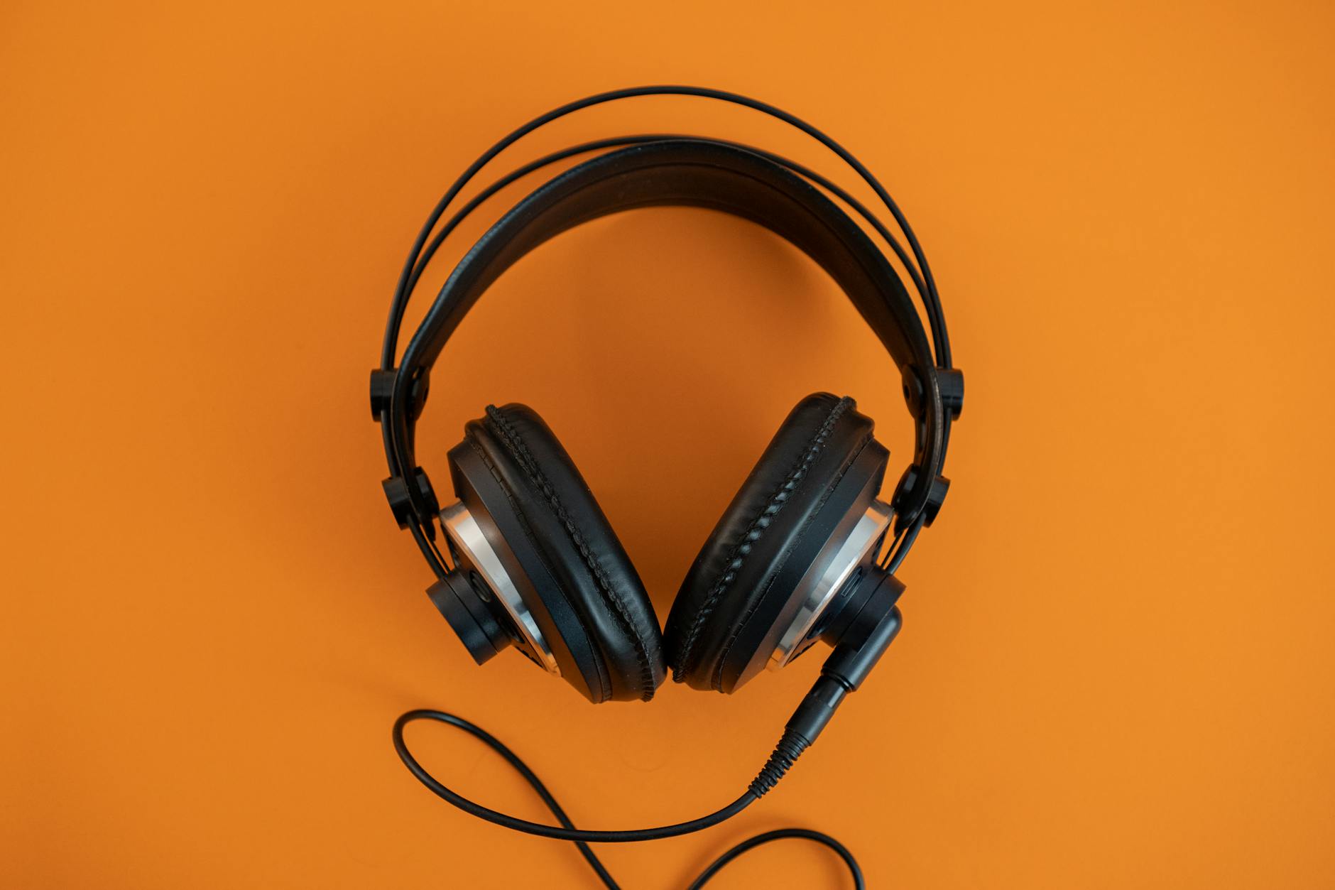 Person wearing headphones while listening to music on streaming platform