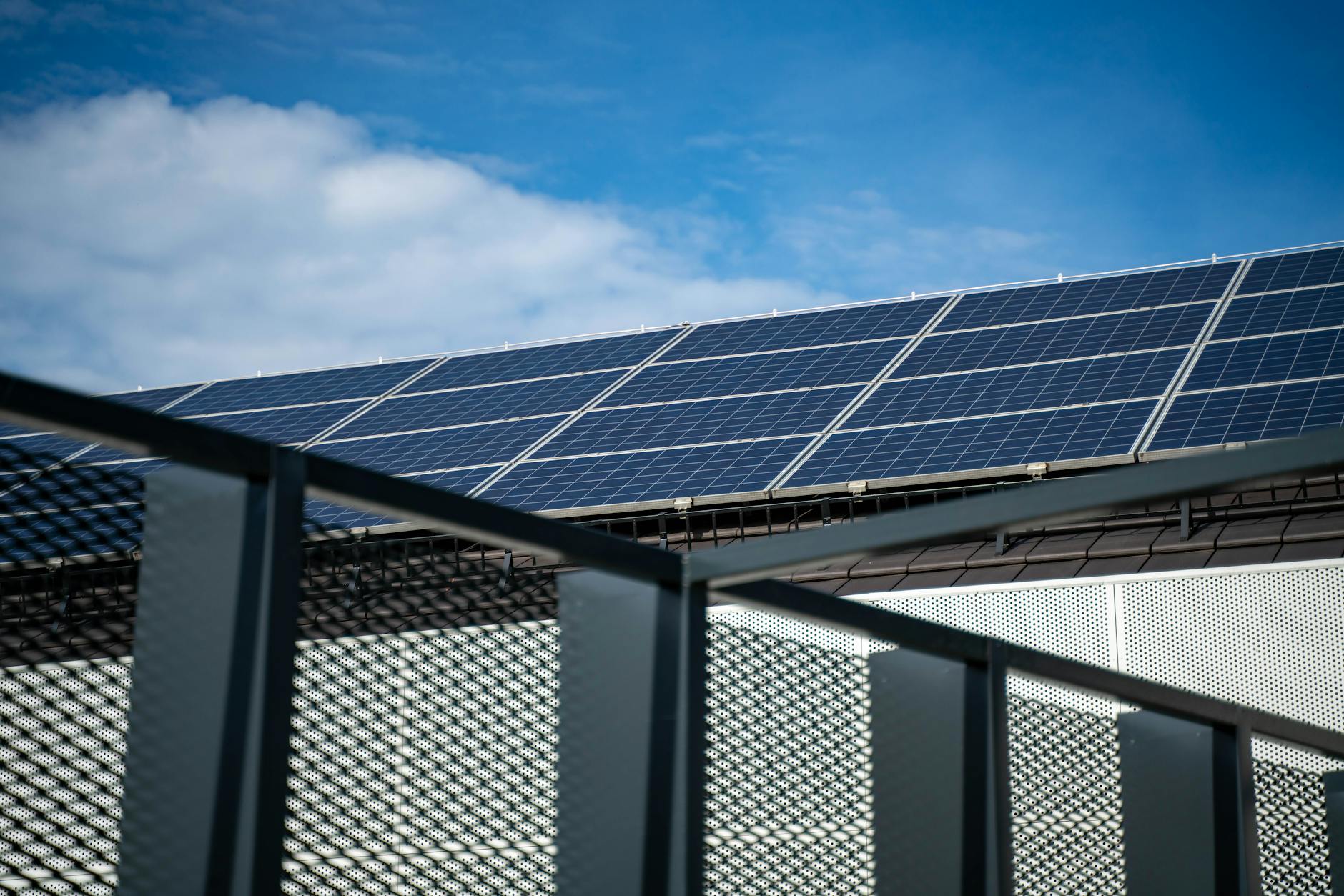 Solar panels installed in rows under bright sunlight generating renewable energy