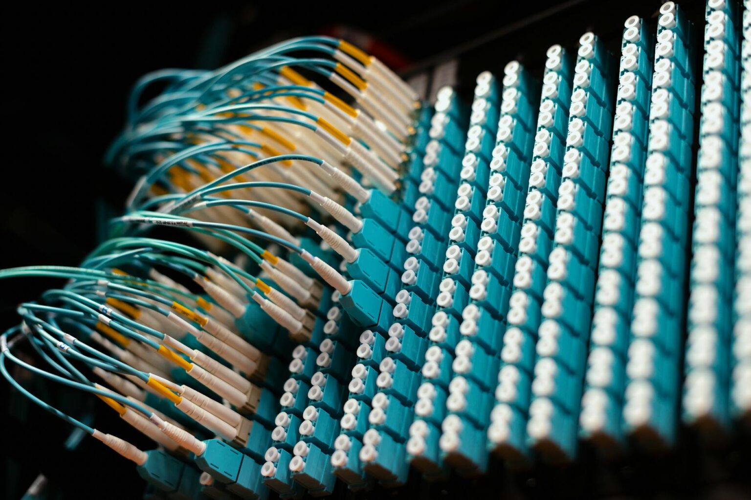 Close-up view of colorful fiber optic cables used in broadband infrastructure projects