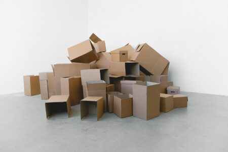 Stack of cardboard shipping boxes representing subscription box deliveries