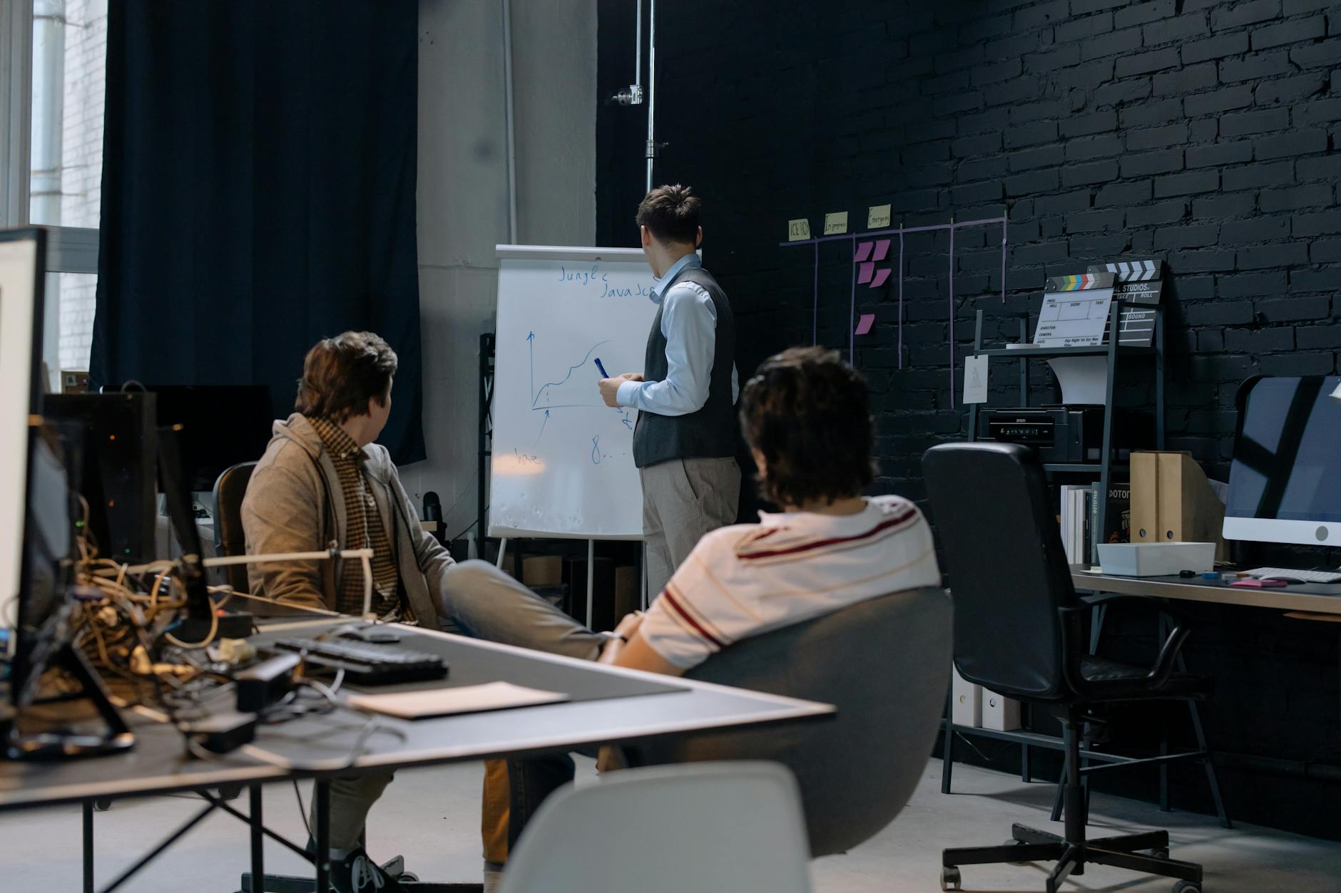 Professional pet groomer washing a dog in a modern grooming salon