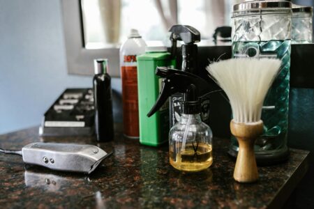 Modern barbershop interior with vintage chairs and product display shelves