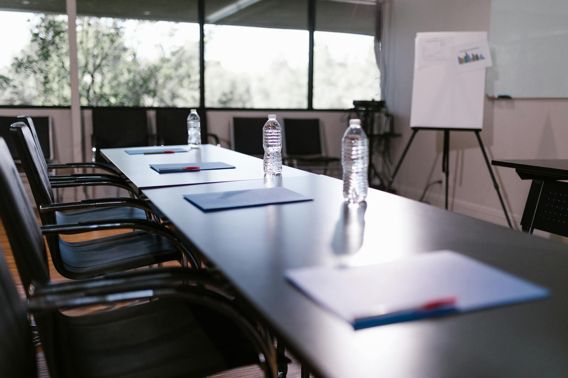 Business professionals gathered around table during corporate meeting