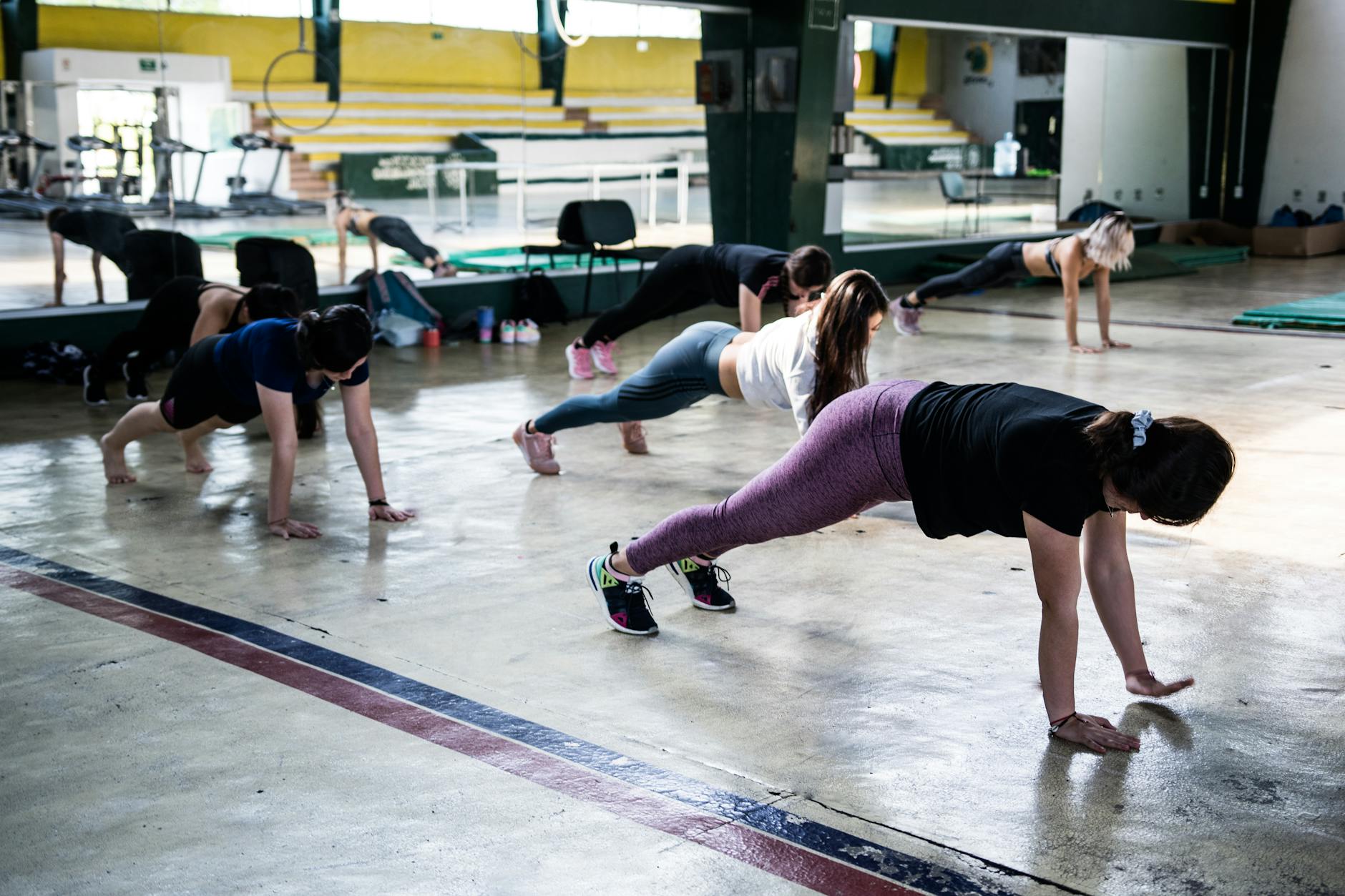 Group of people participating in a fitness class focused on stress relief and mental wellness