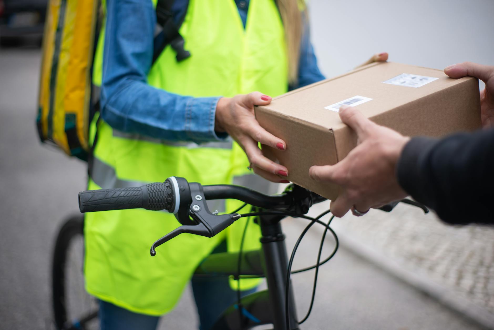 Person collecting packages from automated pickup locker system