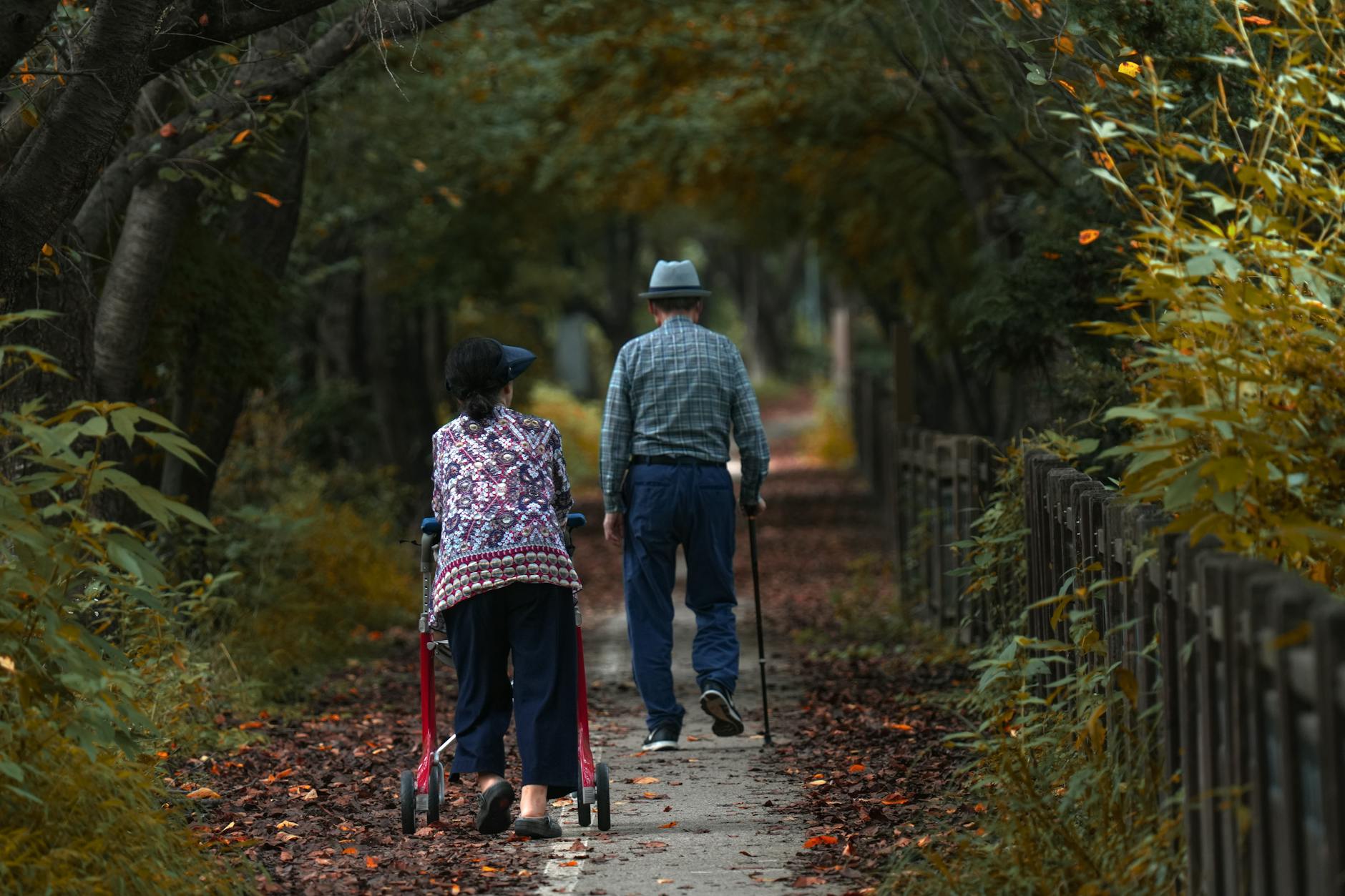 Active senior couple walking together outdoors in a residential community setting