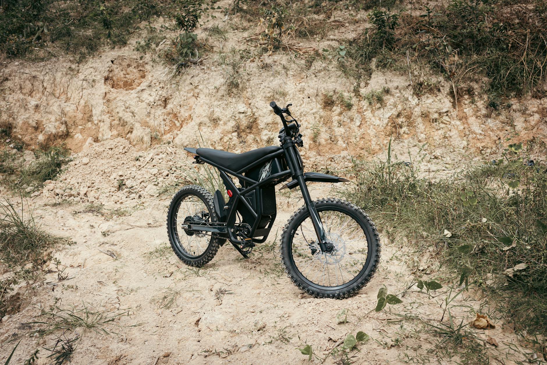 Person riding electric bicycle on scenic trail path