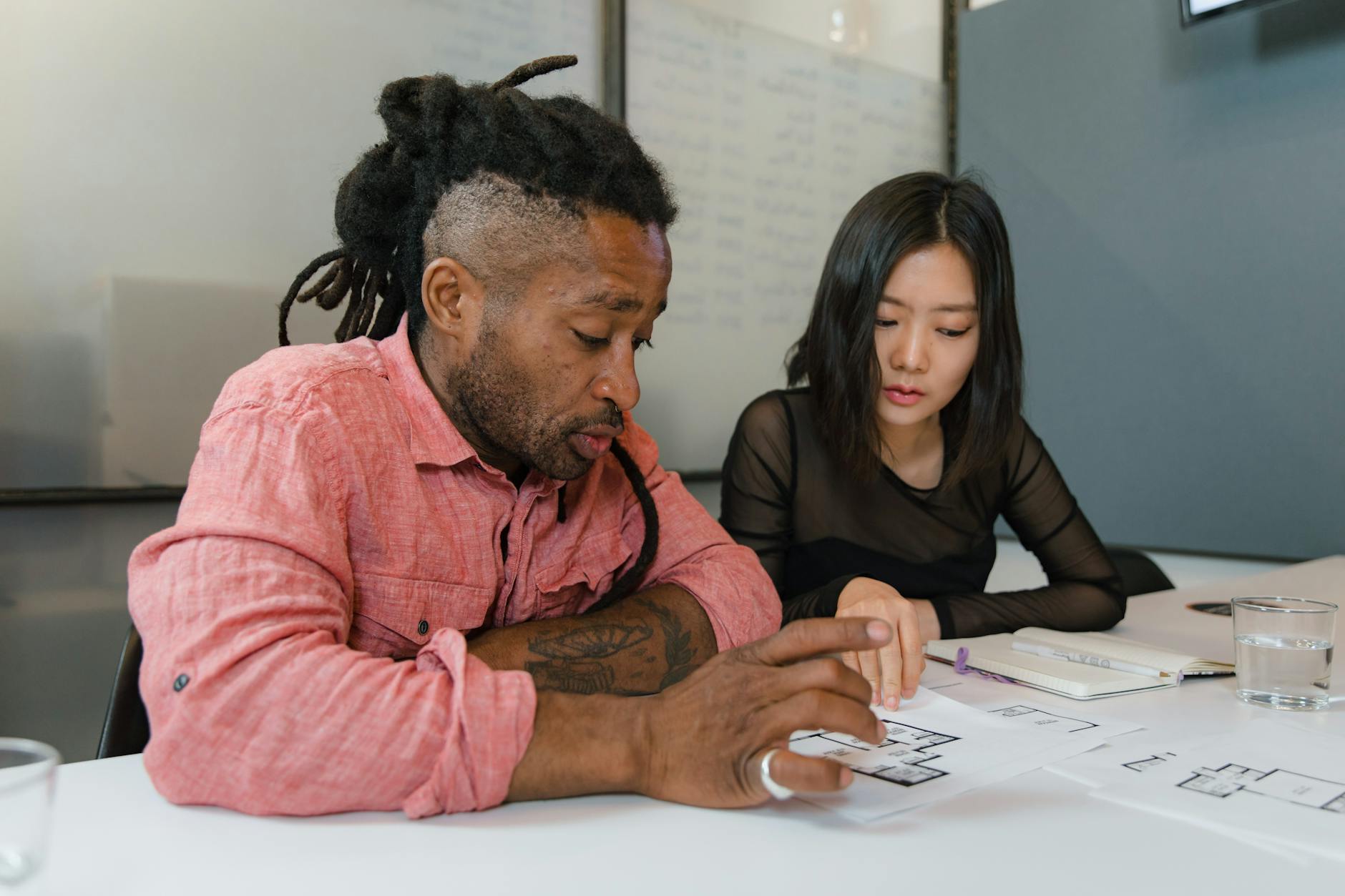 Business professionals in meeting discussing workplace wellness and employee support programs