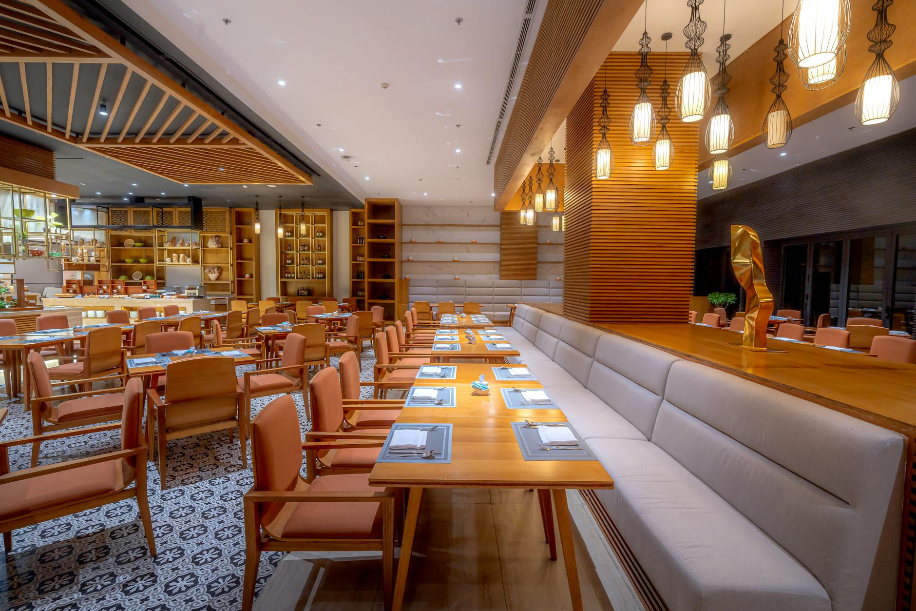 Elegant restaurant dining room with fine table settings and ambient lighting