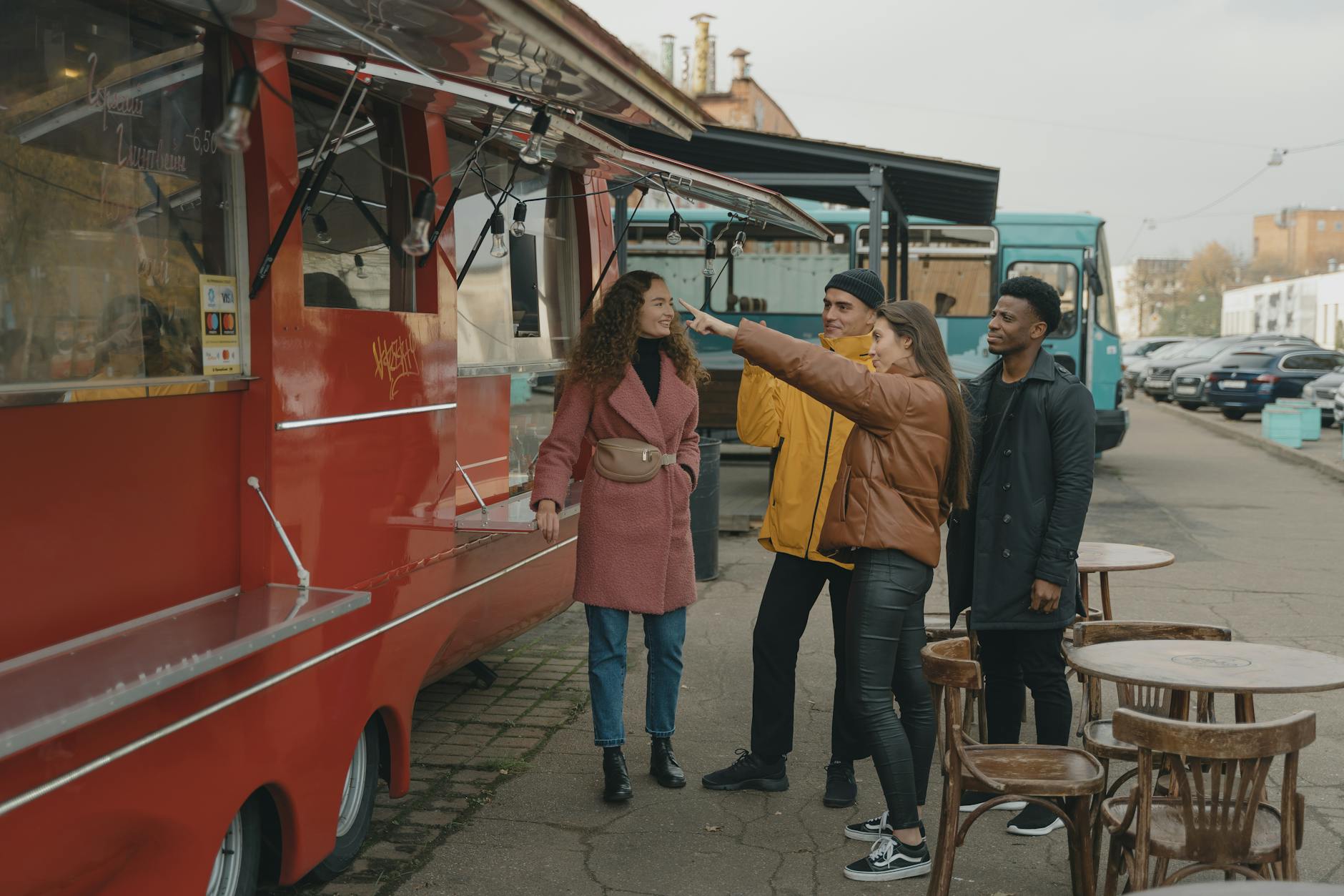 Colorful food truck parked on city street serving customers