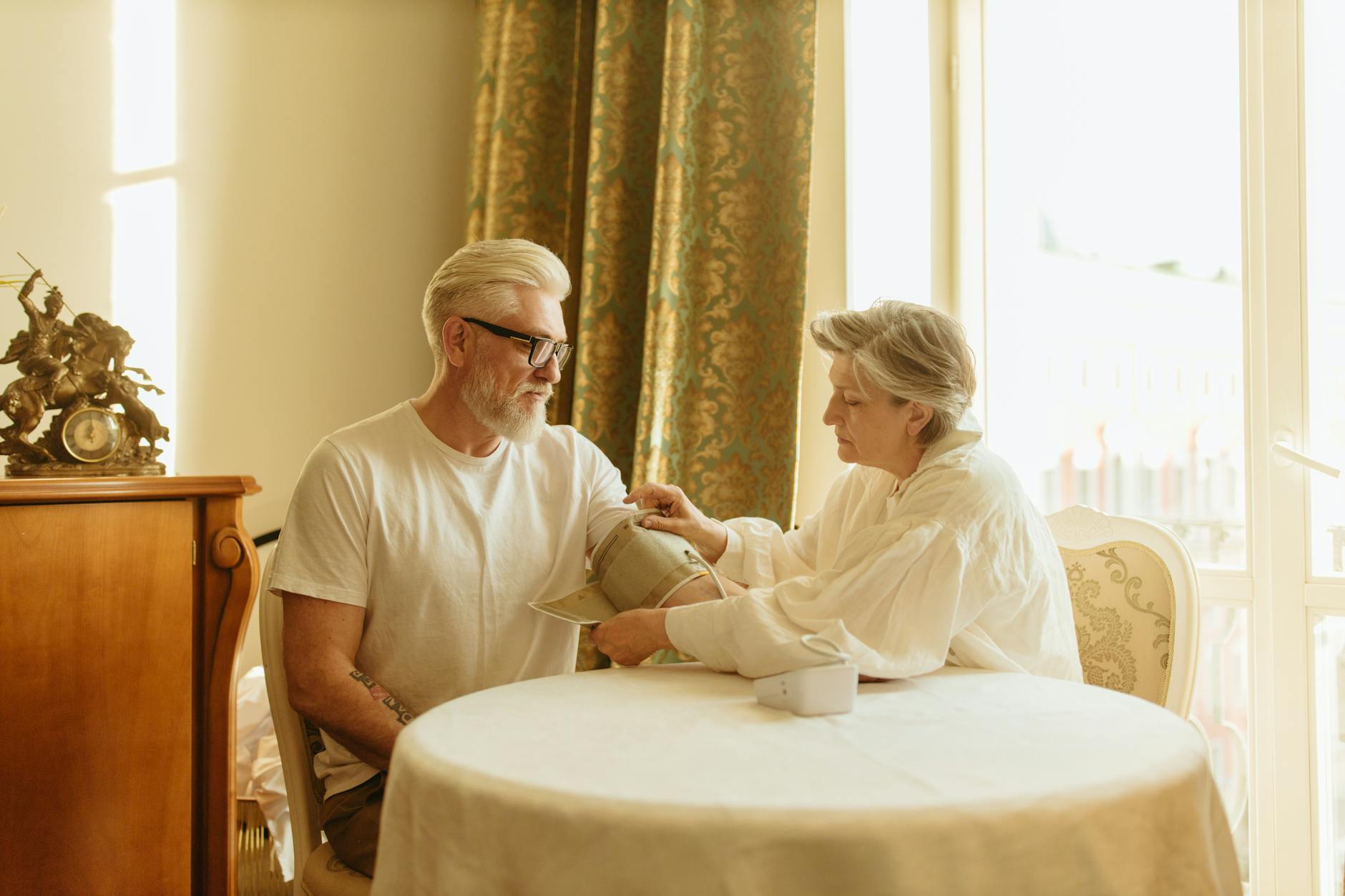 Elderly patient receiving medical care from healthcare professional