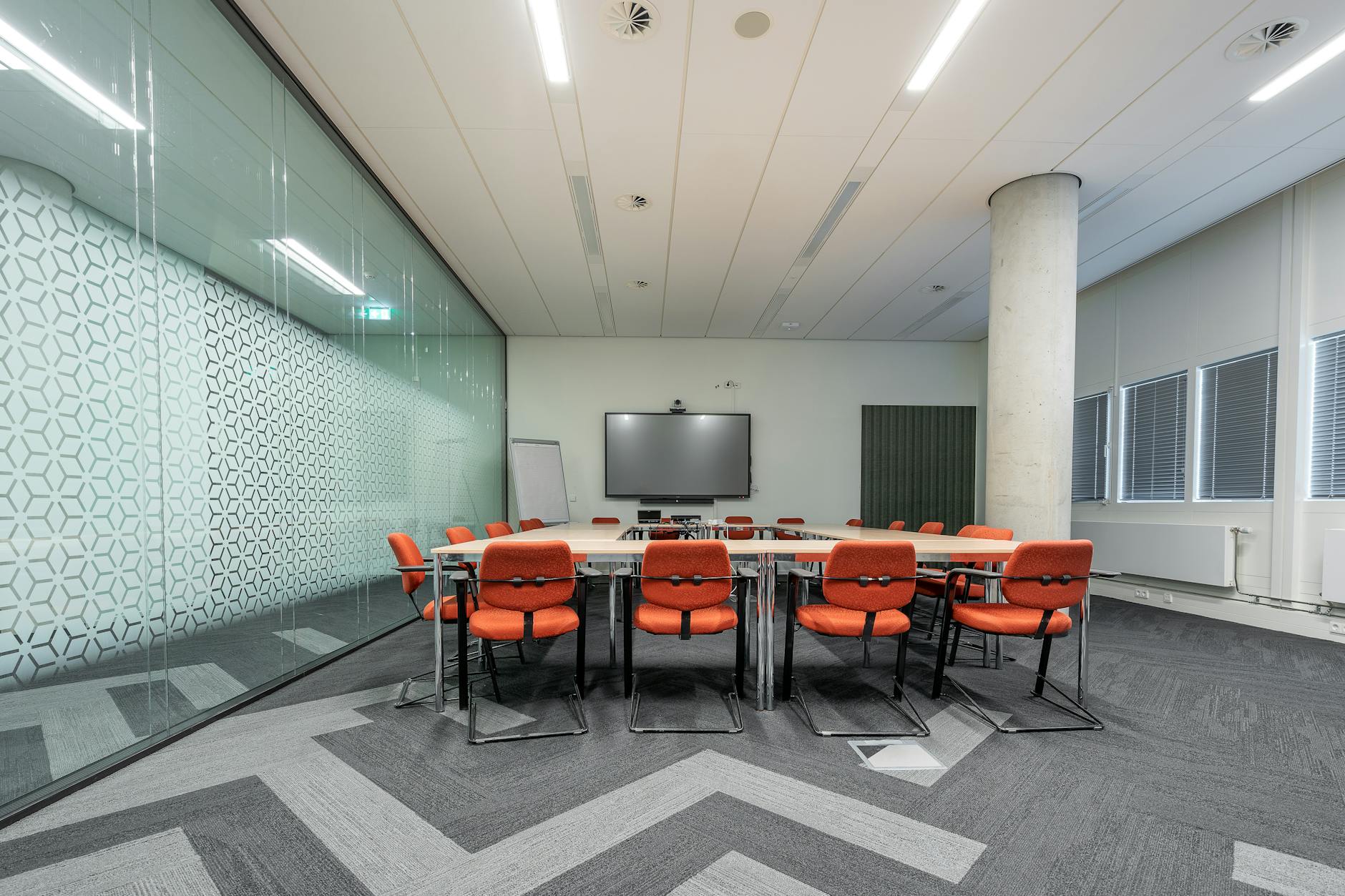 Corporate meeting room with conference table and chairs designed for efficient space utilization
