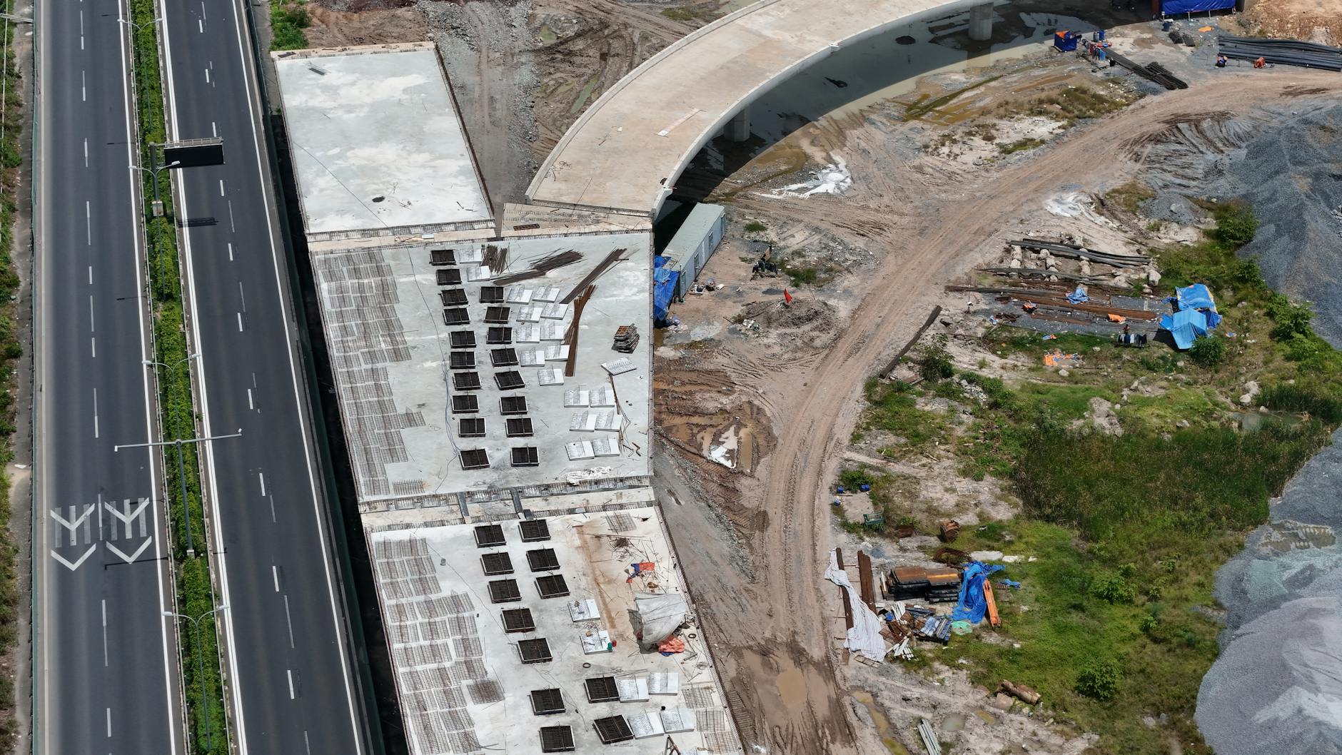 Workers installing electrical infrastructure equipment at construction site