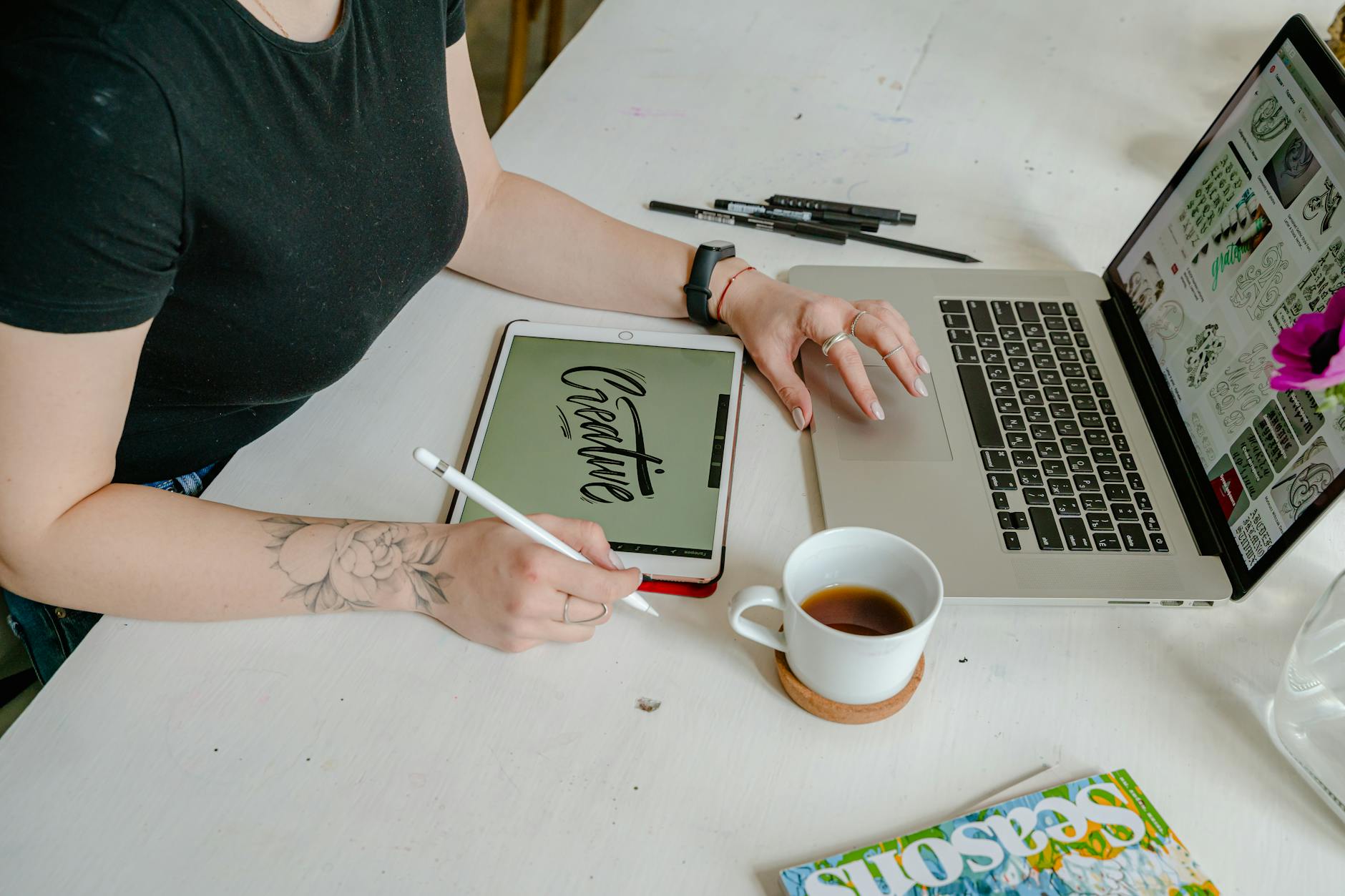 Professional using digital design software on tablet for interior design planning and room visualization