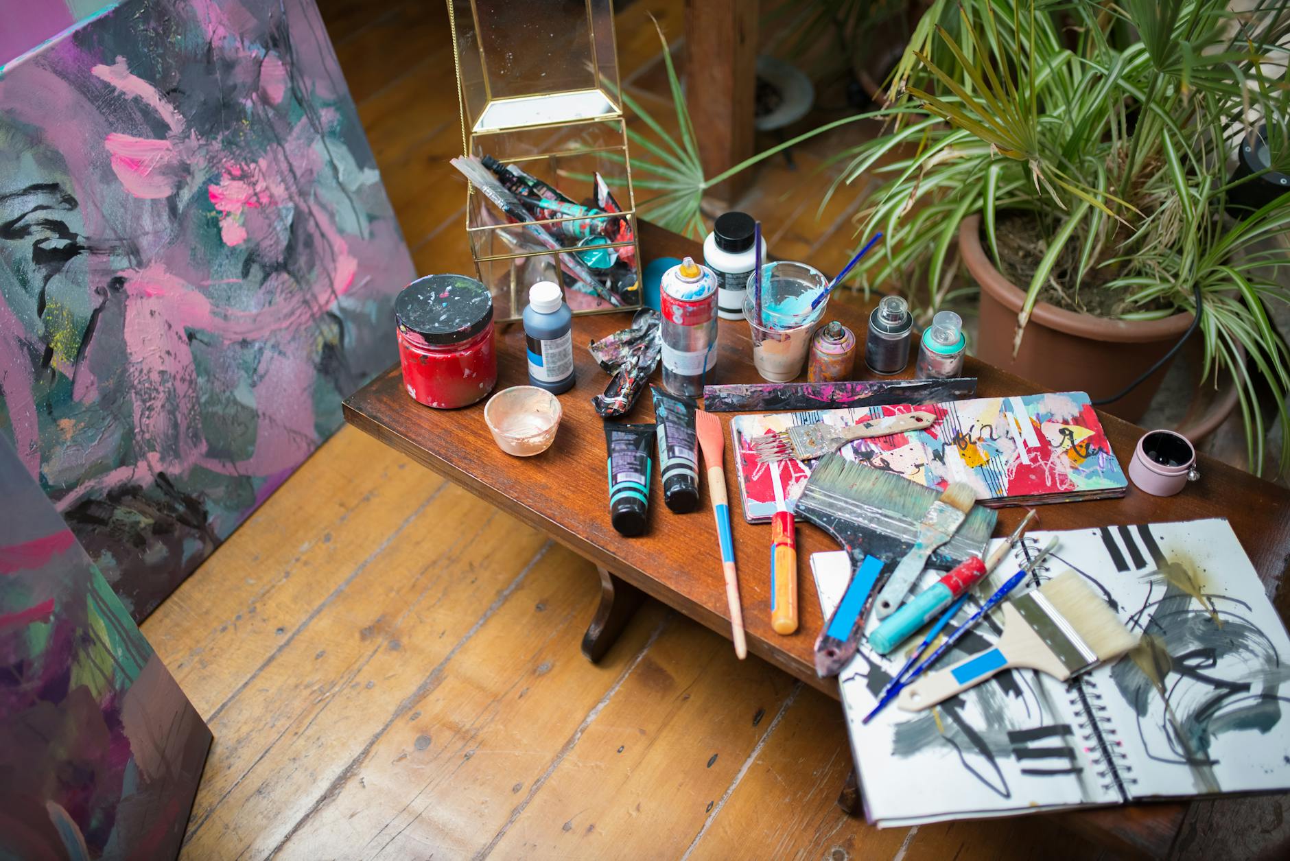 Artist workspace with creative materials representing independent content creation