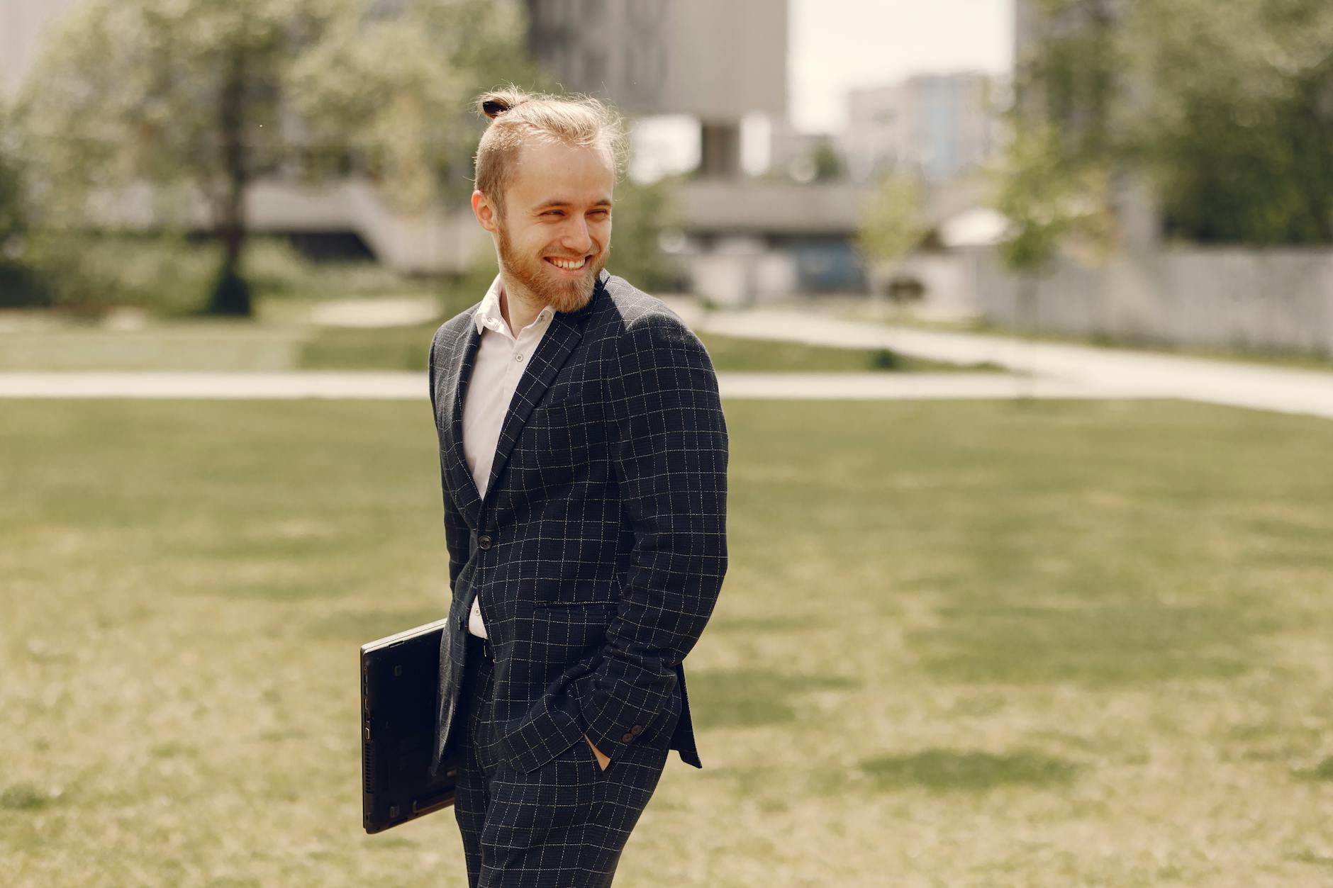 Confident young professional in business attire representing wealthy millennial demographic