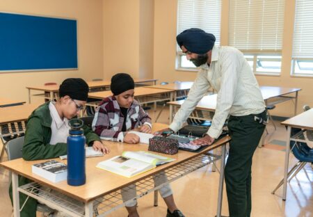 Local Tutoring Centers Pivot Toward Test Prep Franchise Models Students studying at desks inside a tutoring center classroom