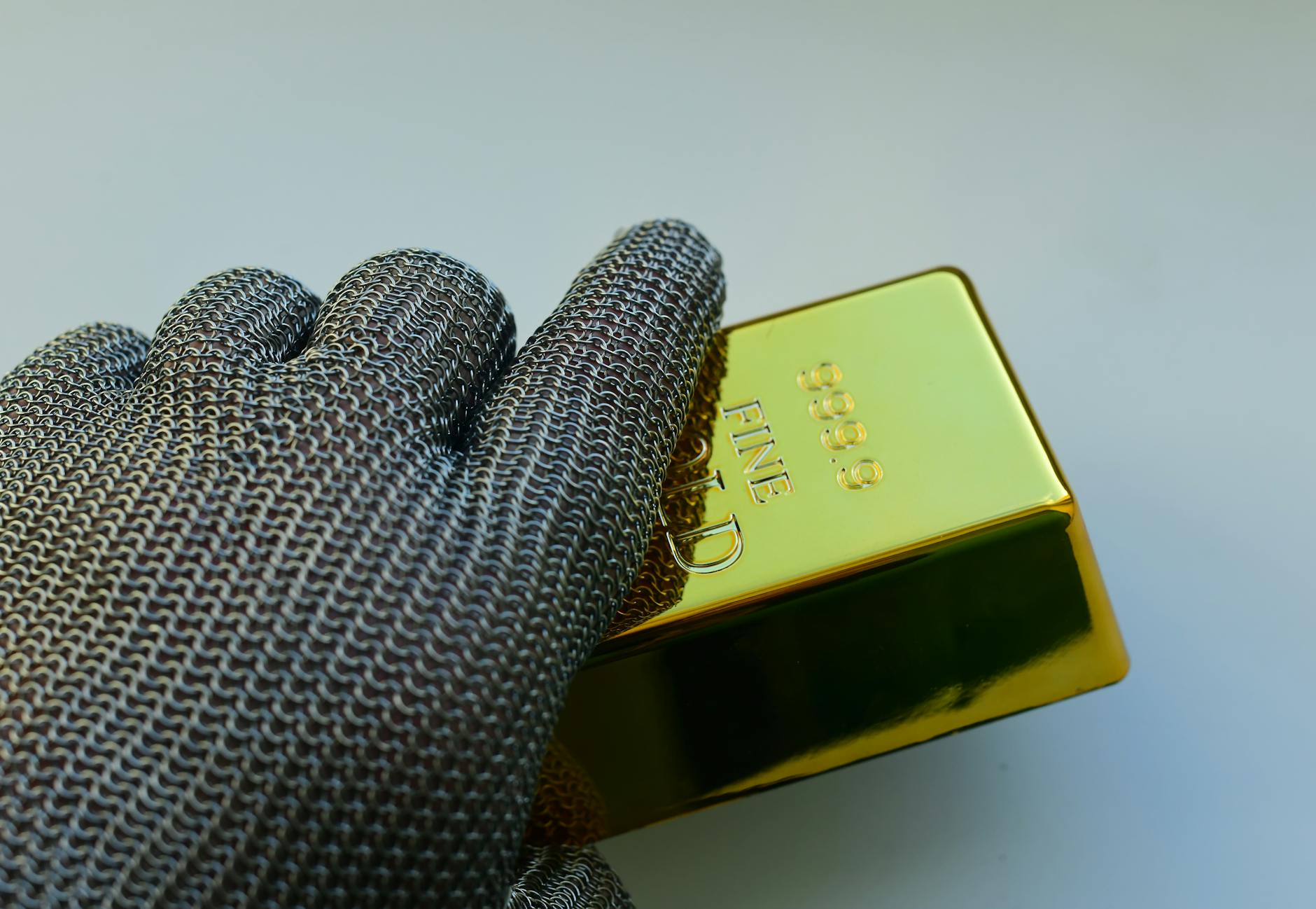 Stacked gold bars representing gold as a safe-haven asset for investors