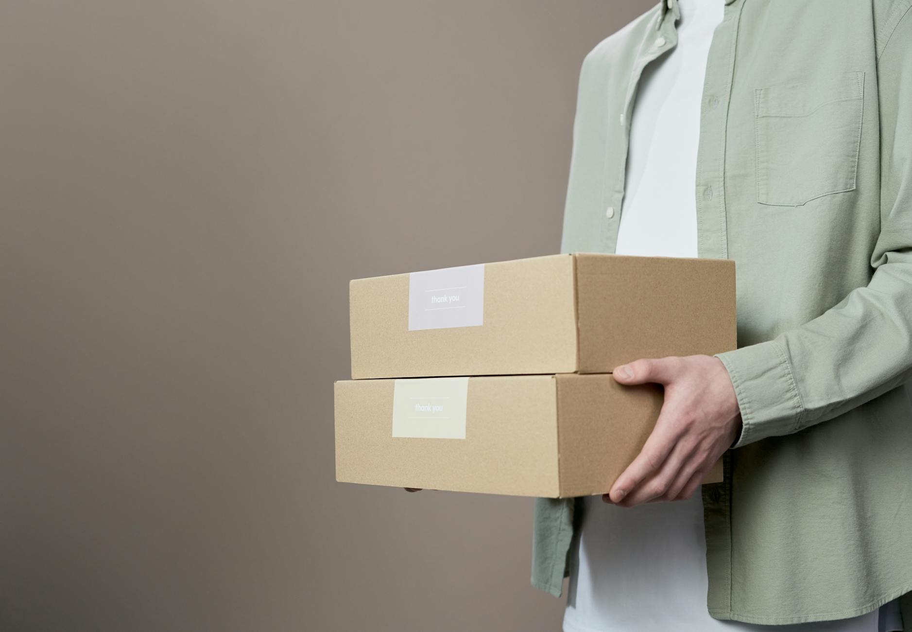 Assorted custom branded packaging boxes and mailers displayed on table