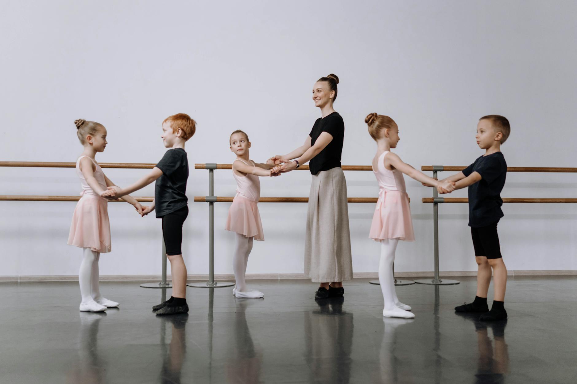 A group of adult beginners following an instructor during a dance lesson