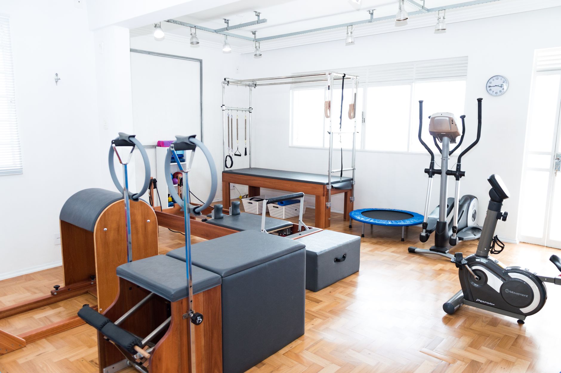 Clean modern fitness studio with professional exercise equipment