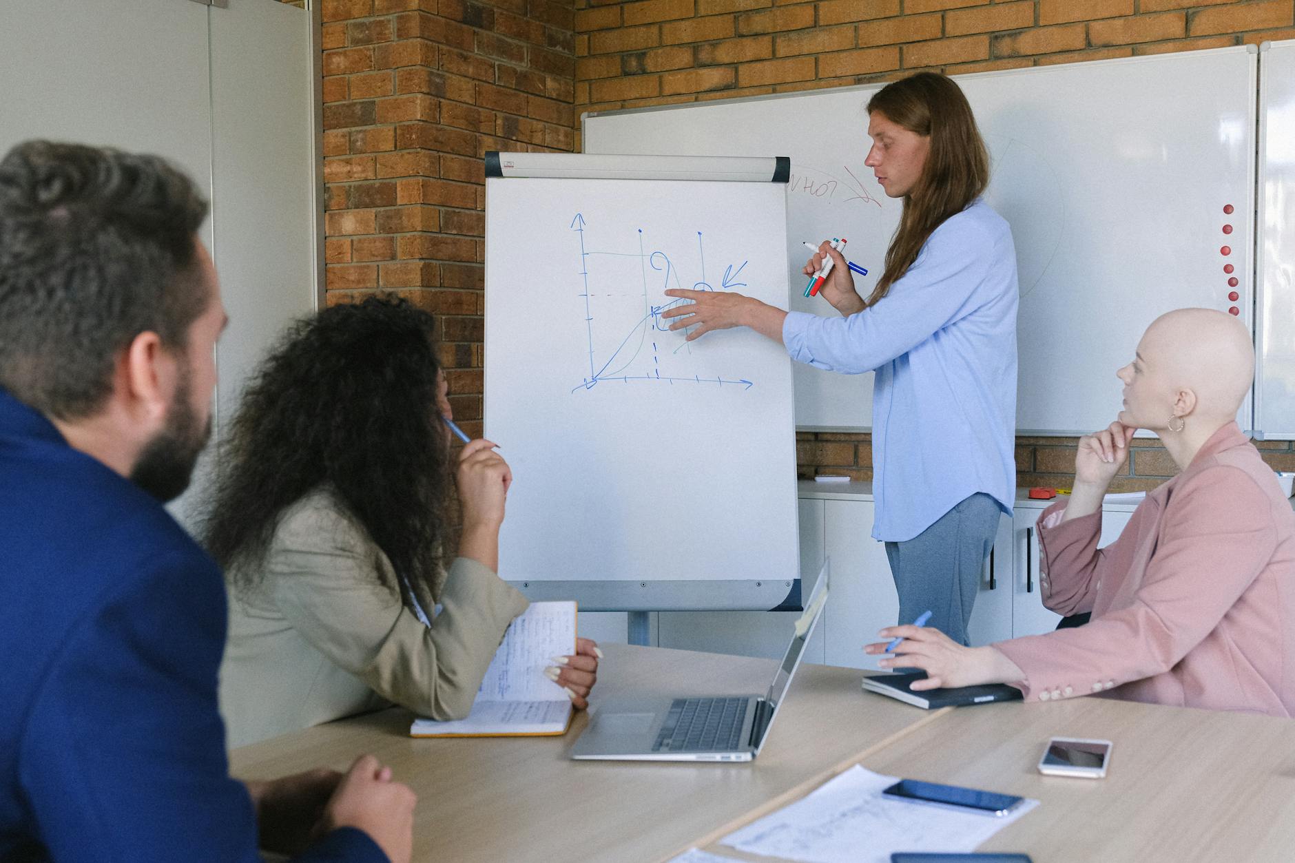 Adults participating in a hands-on creative workshop together in a studio space