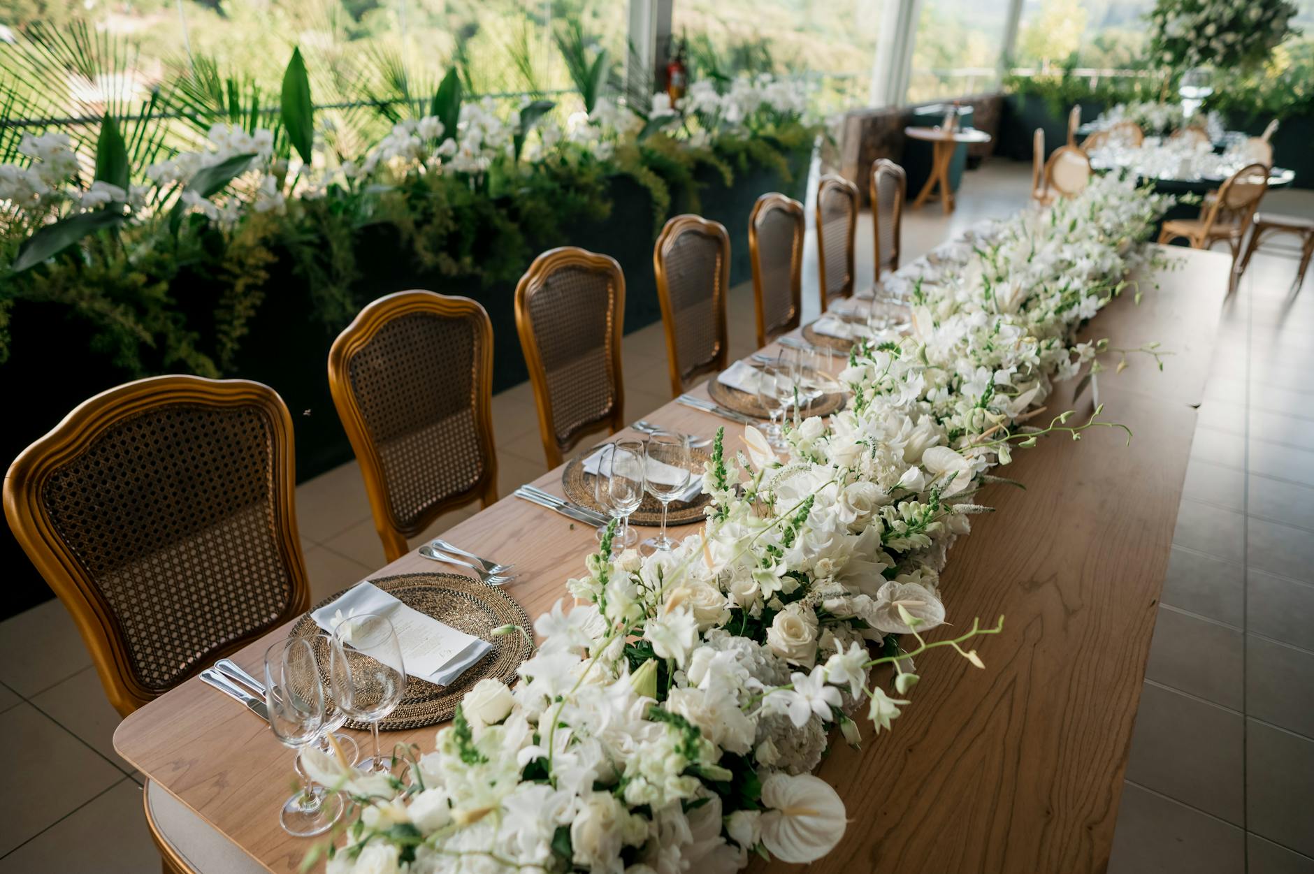 Small wedding reception with beautifully decorated tables and ambient lighting for intimate gathering