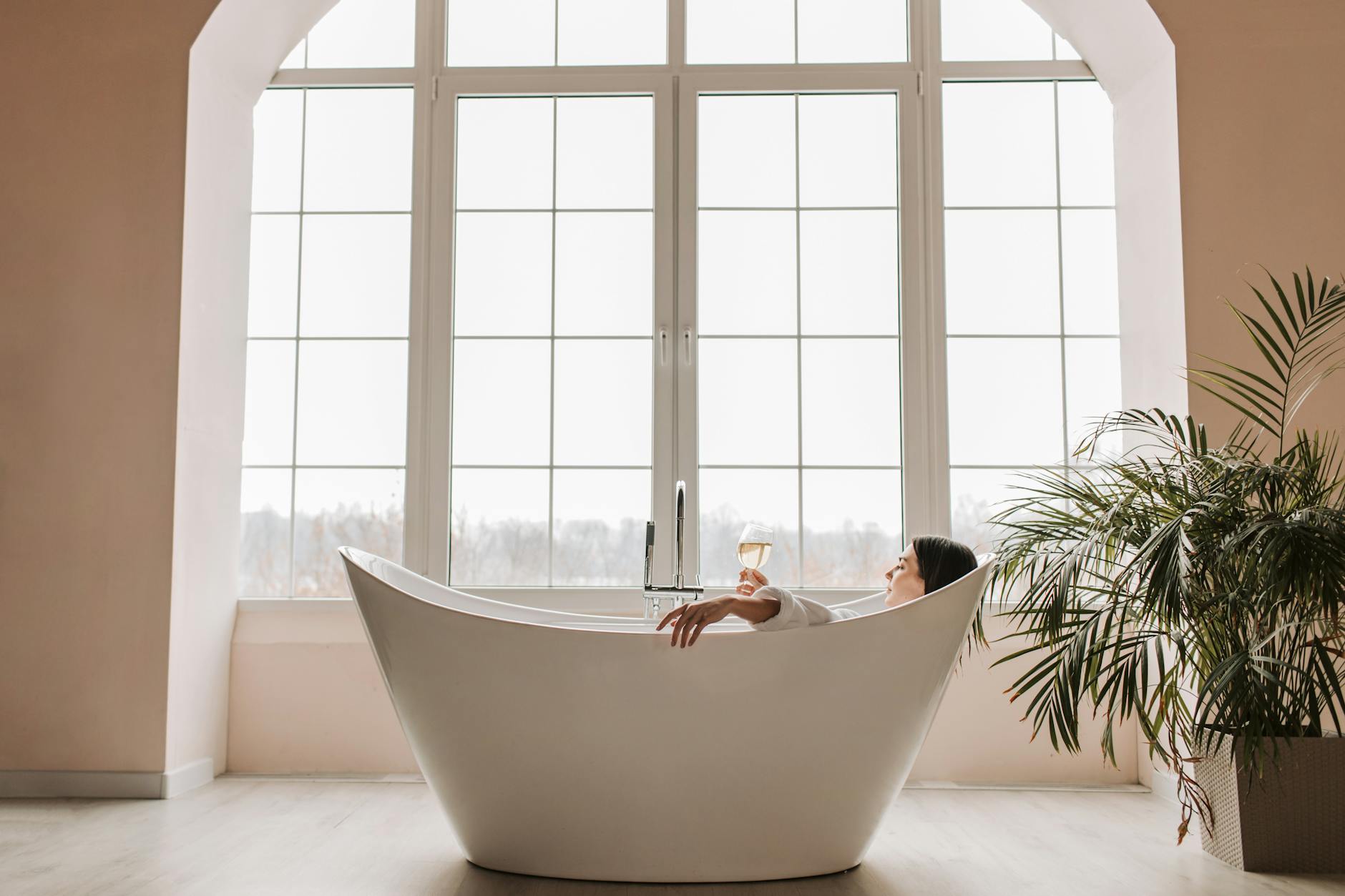 Person relaxing in a private sauna room during a wellness session