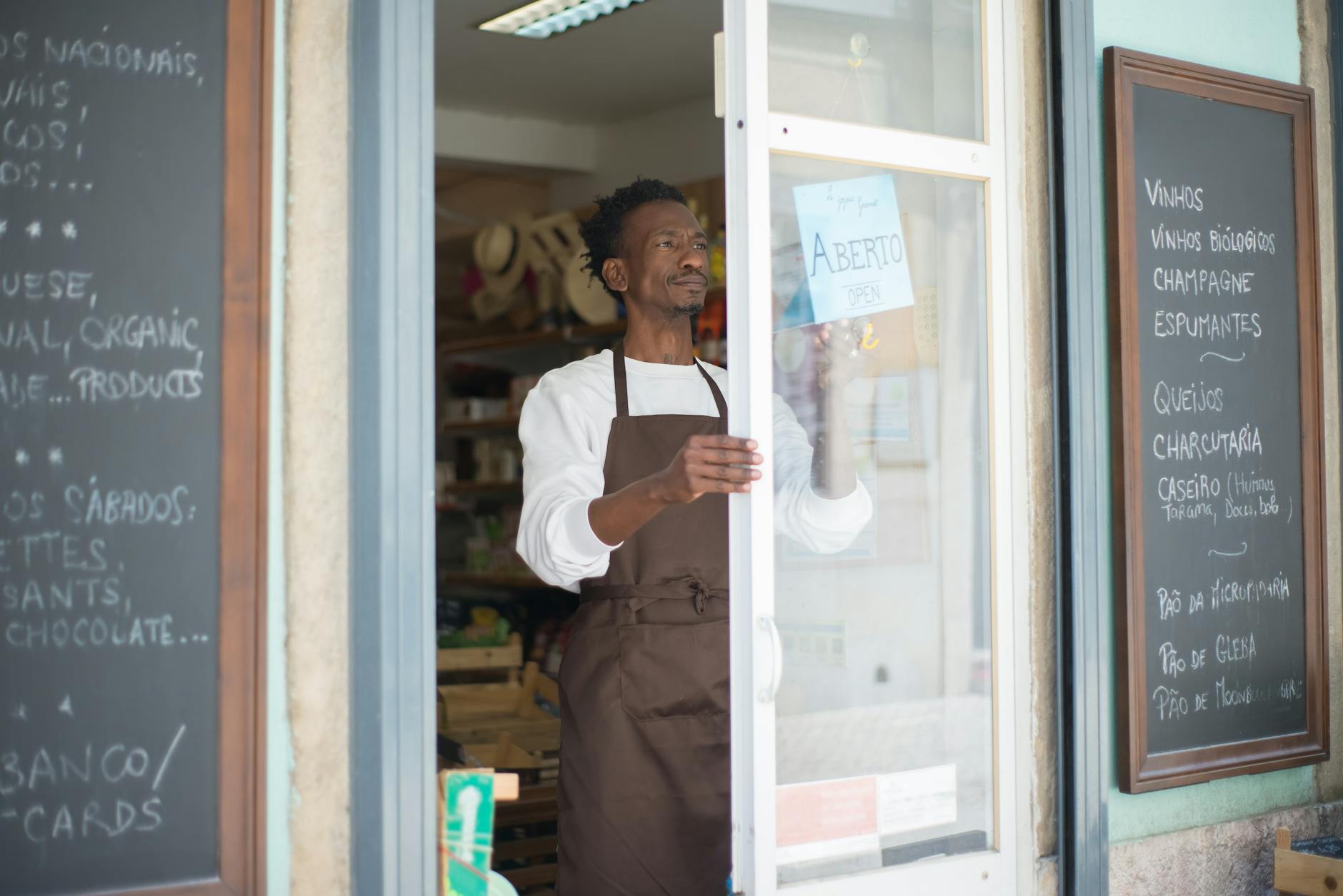 Small business owner reviewing paperwork at a front desk