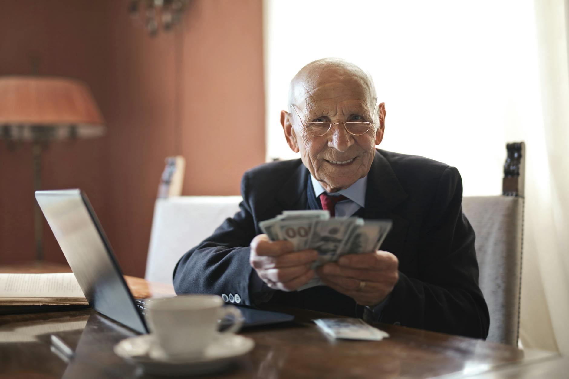 Person reviewing retirement income documents and financial statements