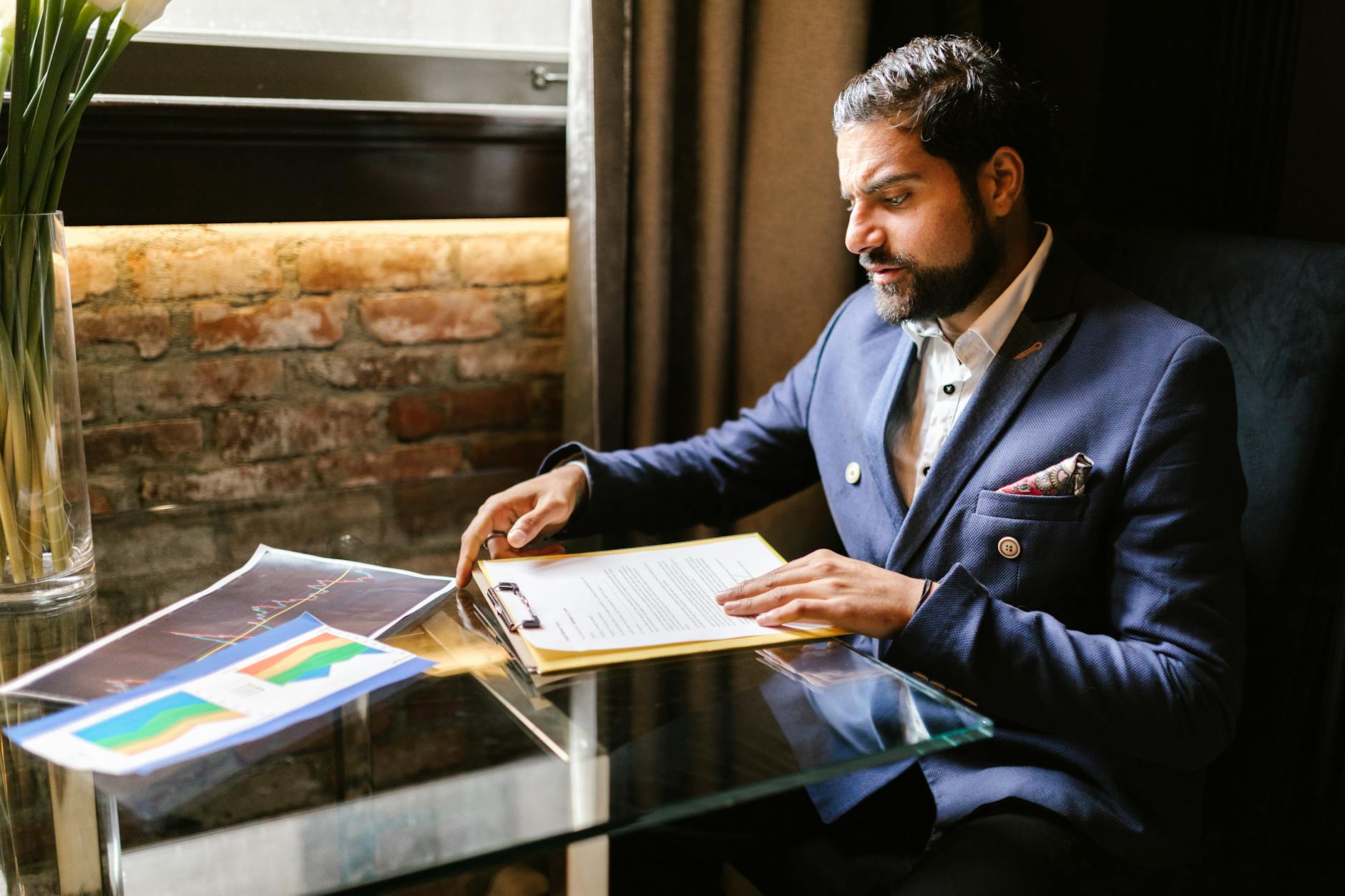 Investor reviewing a financial report at a desk