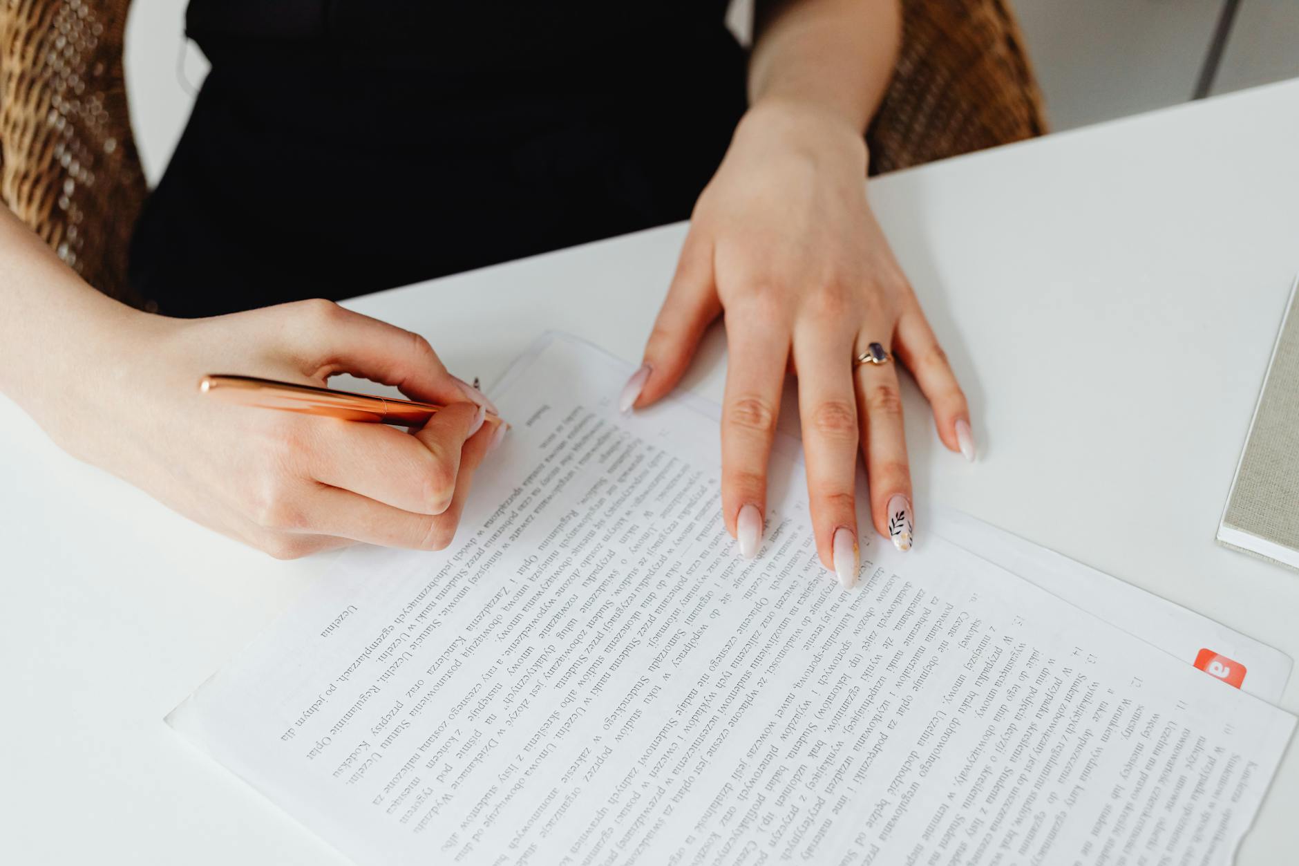 Professional woman receiving manicure service in office setting