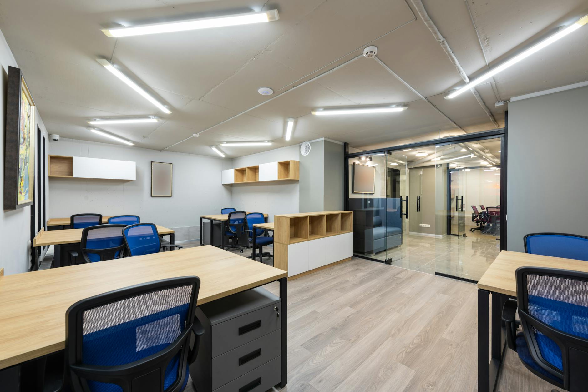Professional office space with modern furniture and large windows for commercial real estate photography