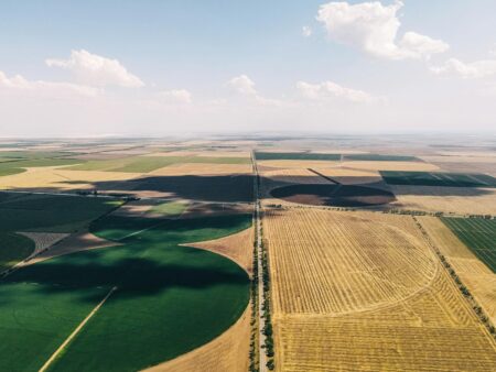 Aerial view of farmland representing physical real asset investments