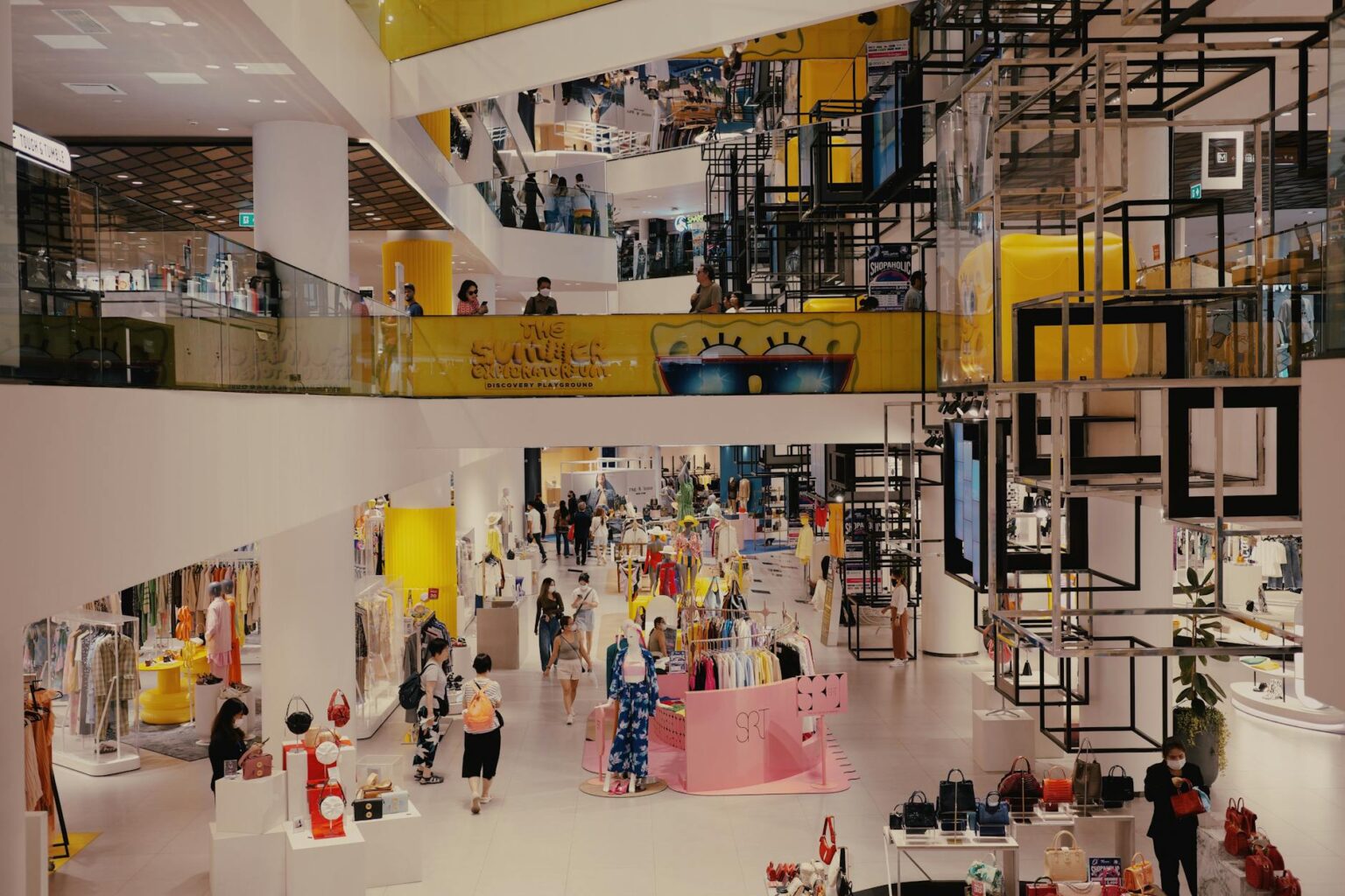 Interior of a mid-size retail store with merchandise displays and lighting