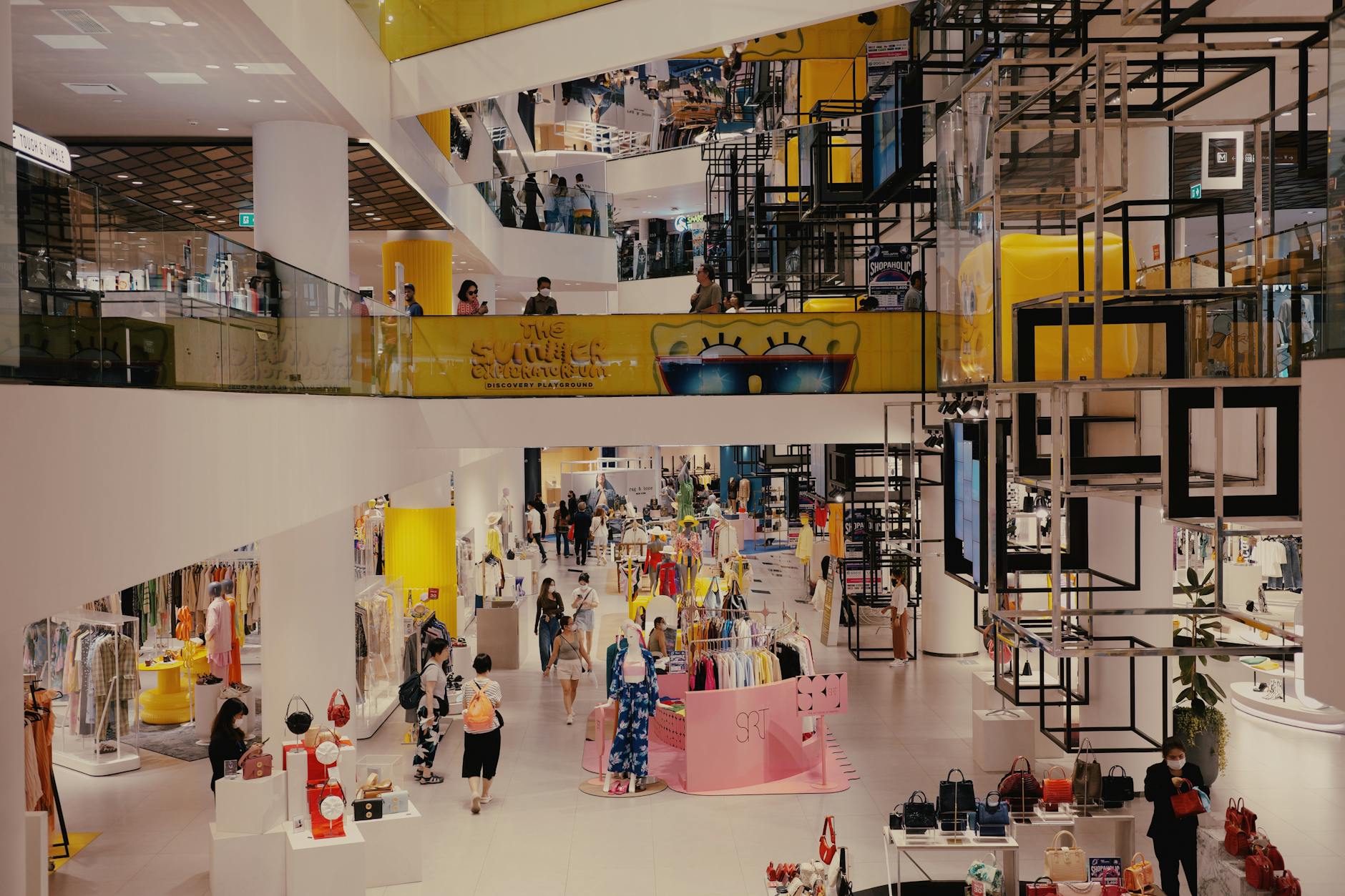 Interior of a mid-size retail store with merchandise displays and lighting