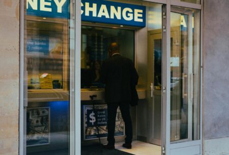 Emerging Market Currency ETFs Draw Fresh Capital During Dollar Slide Currency exchange board showing multiple foreign currency rates fluctuating