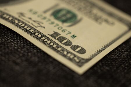 Paper savings bonds and financial documents representing government bond investments