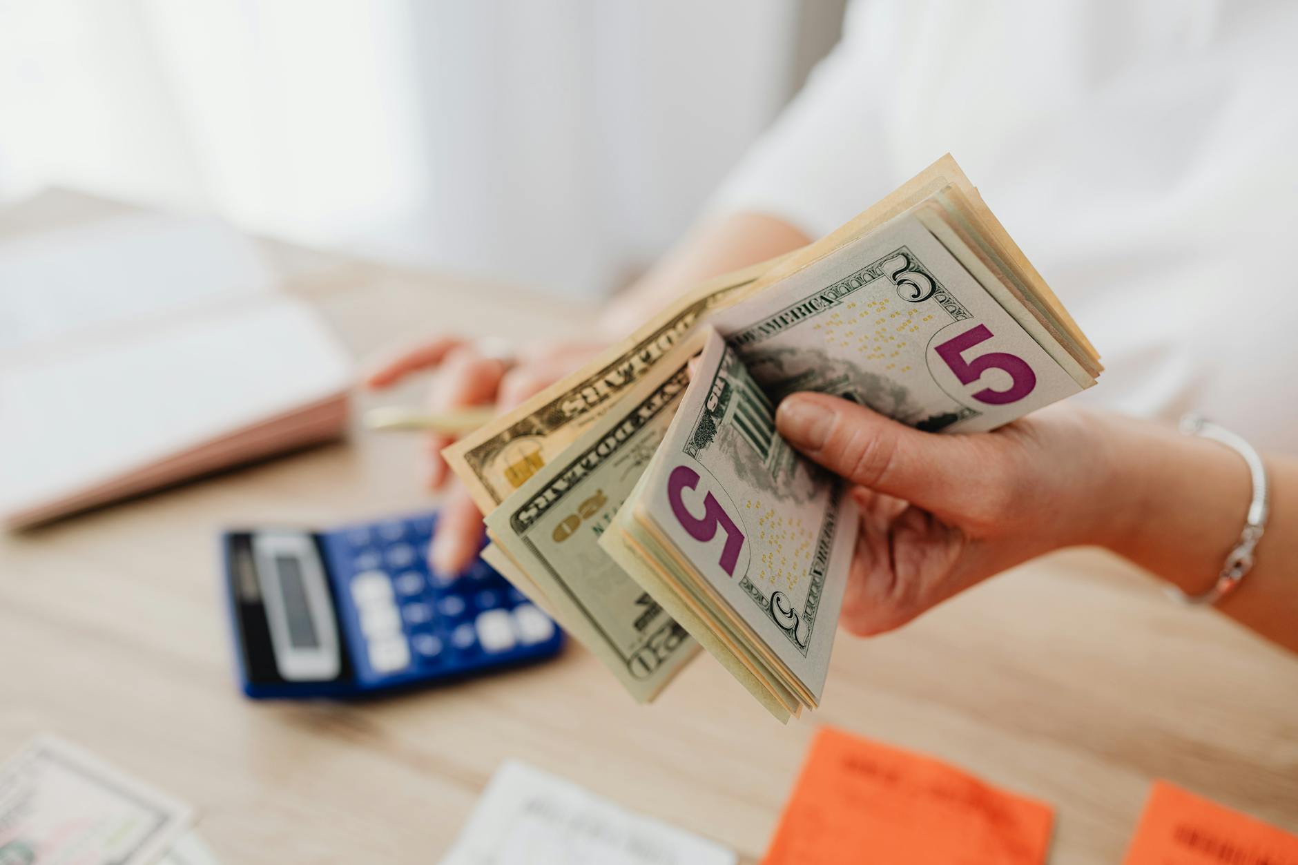 Stacks of cash and financial documents representing money market investment decisions