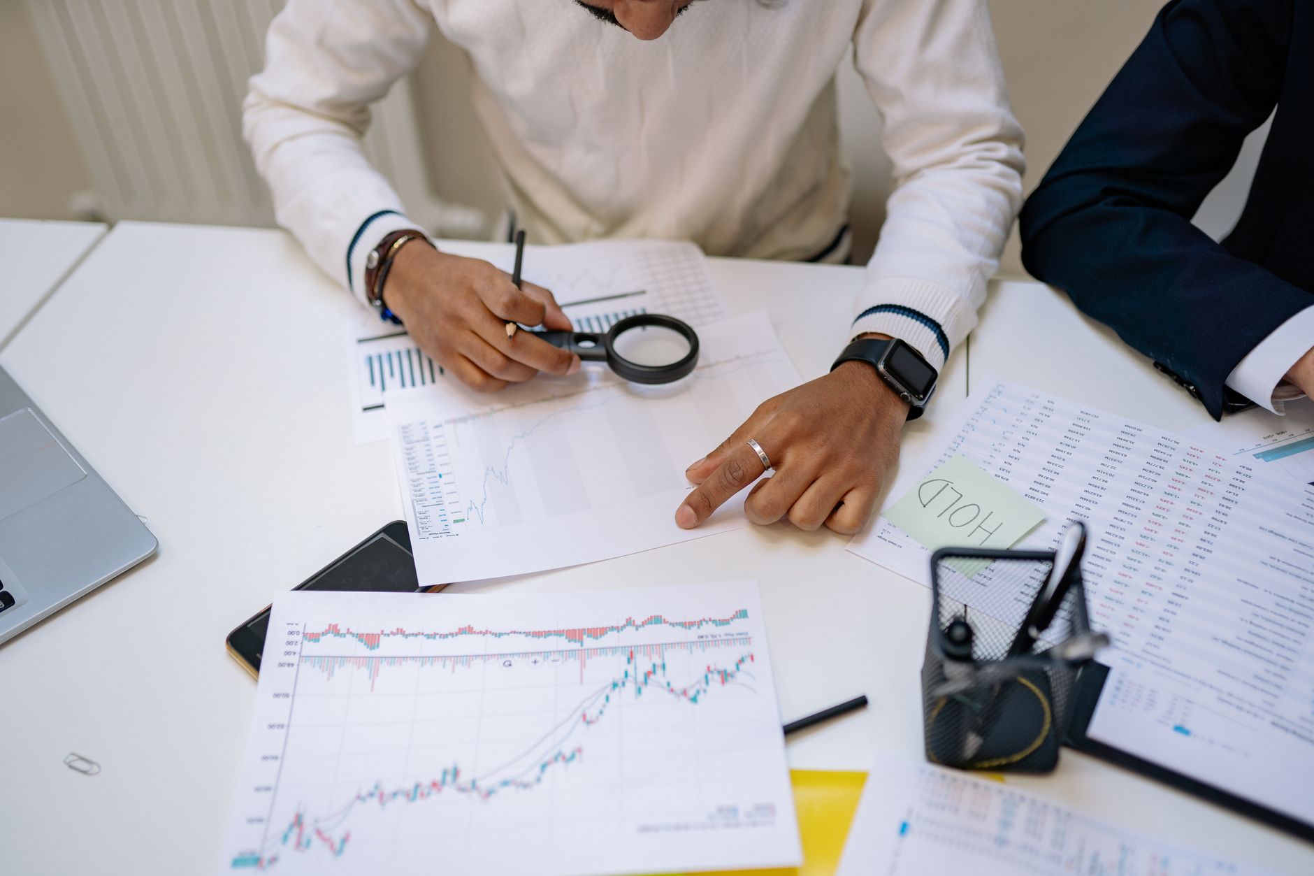 Financial analyst reviewing investment data on a computer monitor