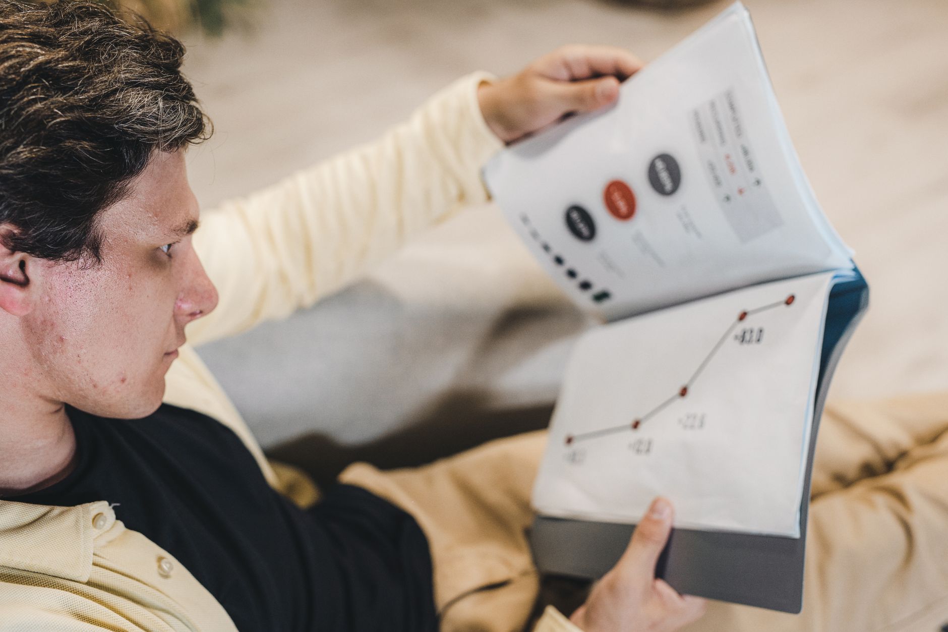 An investor reviewing fund documents and financial reports