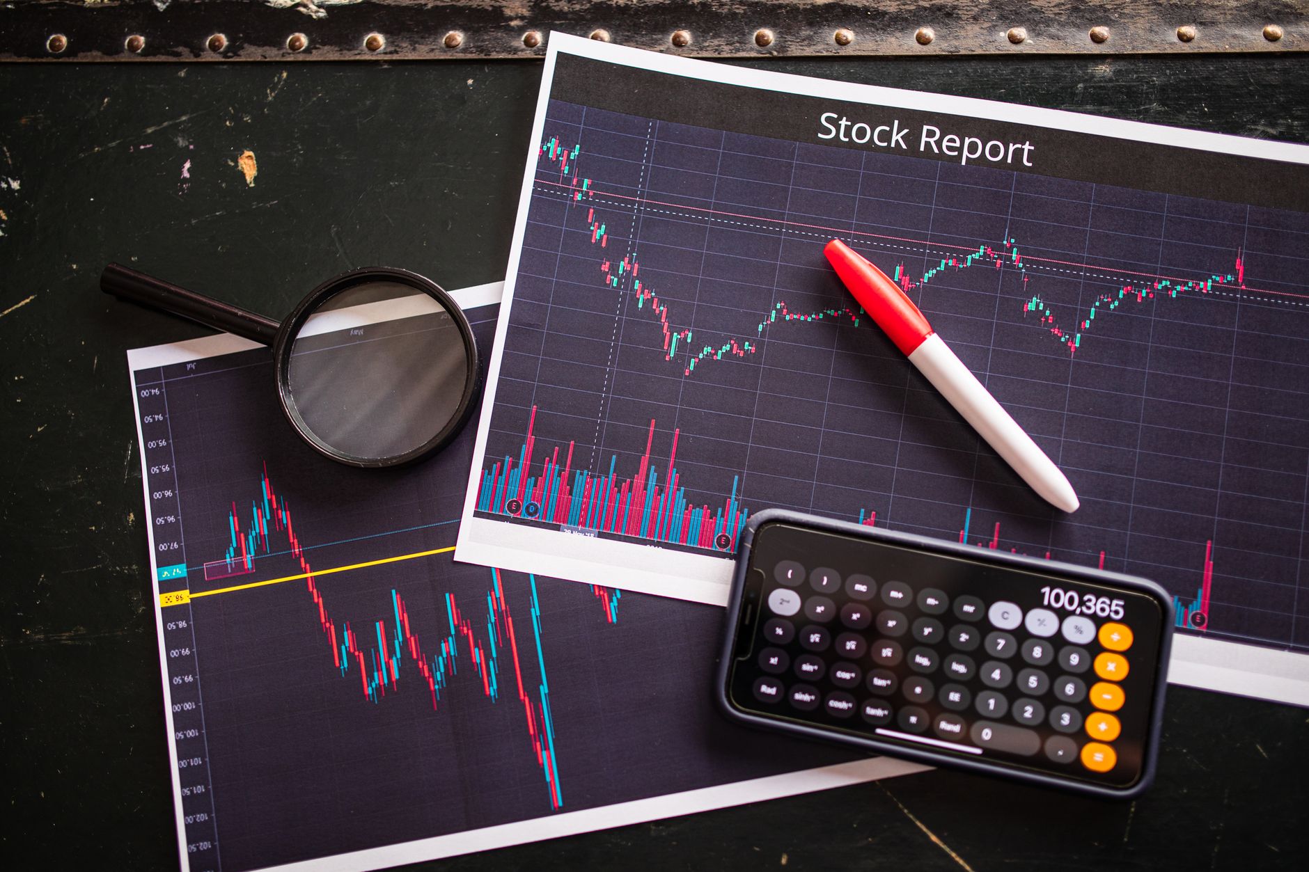 Investor reviewing portfolio allocation documents at a desk