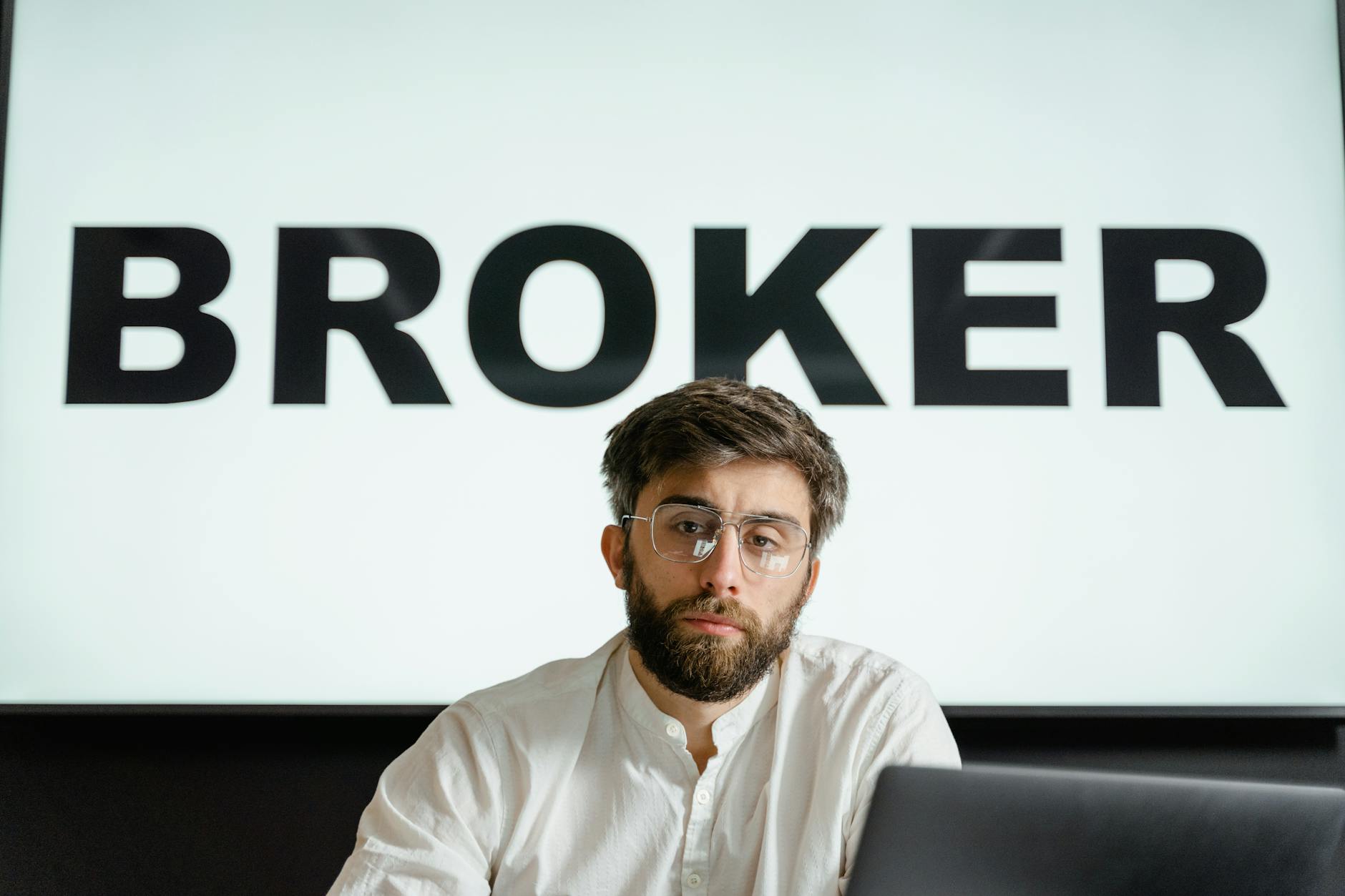 Professional investor reviewing portfolio allocation in a modern office setting