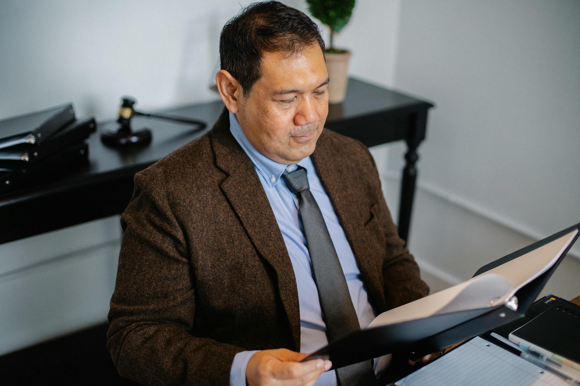 Professional investor analyzing fund documents and income distribution reports