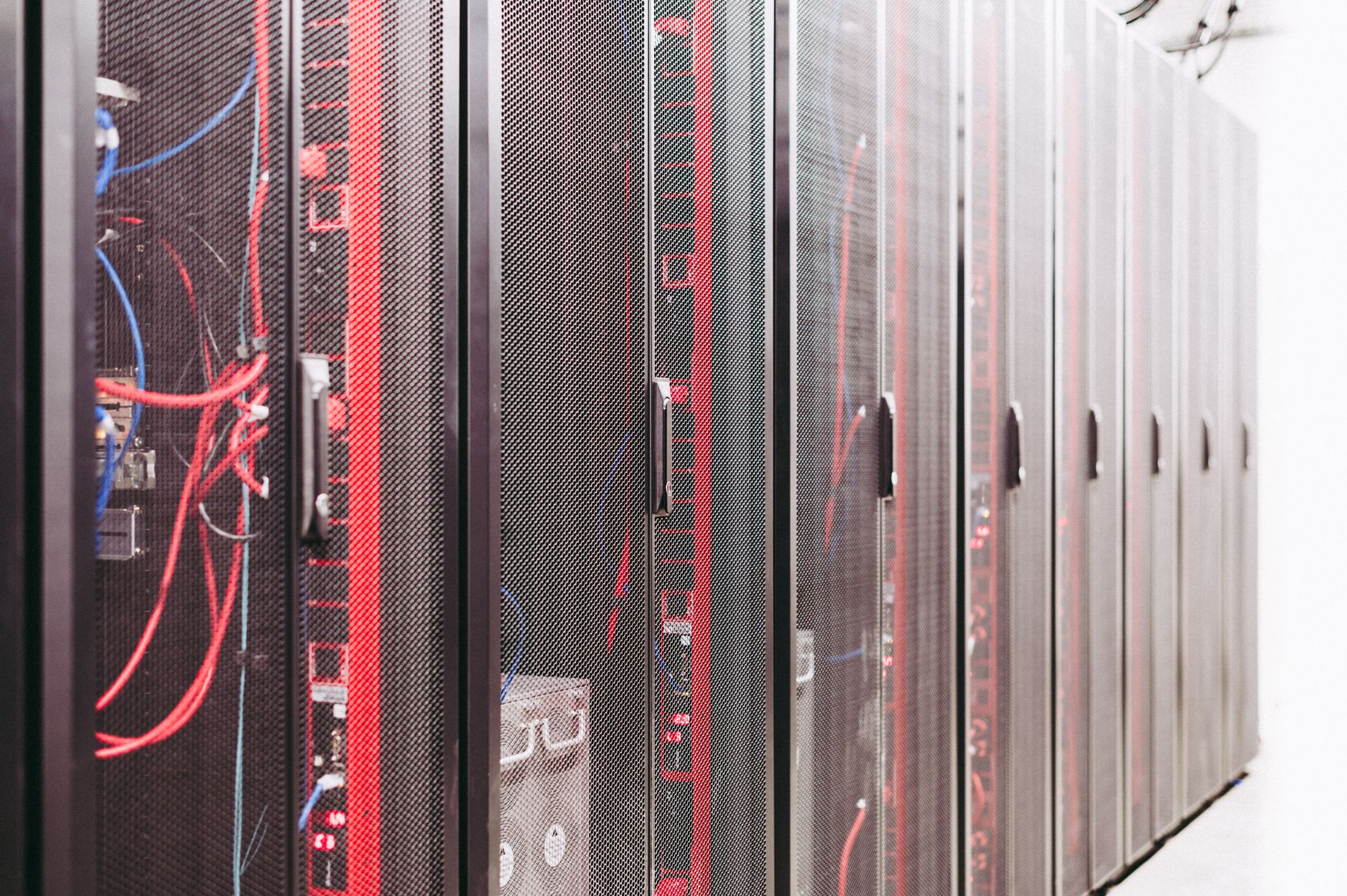 Rows of servers inside a modern data center facility