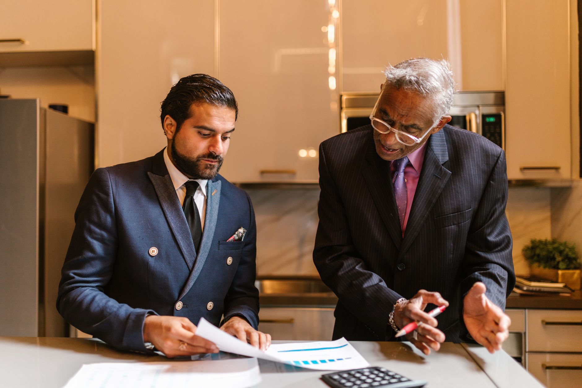 Financial advisor discussing portfolio strategy with a client at a desk